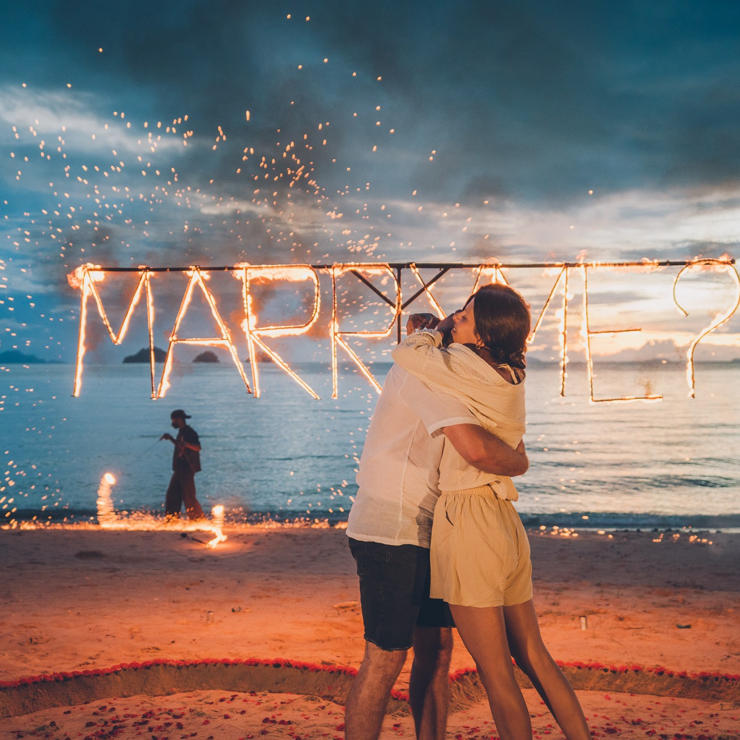 Luxury beach proposal in Koh Samui, Thailand. Private sunset setup with candles, flowers, and ocean view for an unforgettable engagement experience.