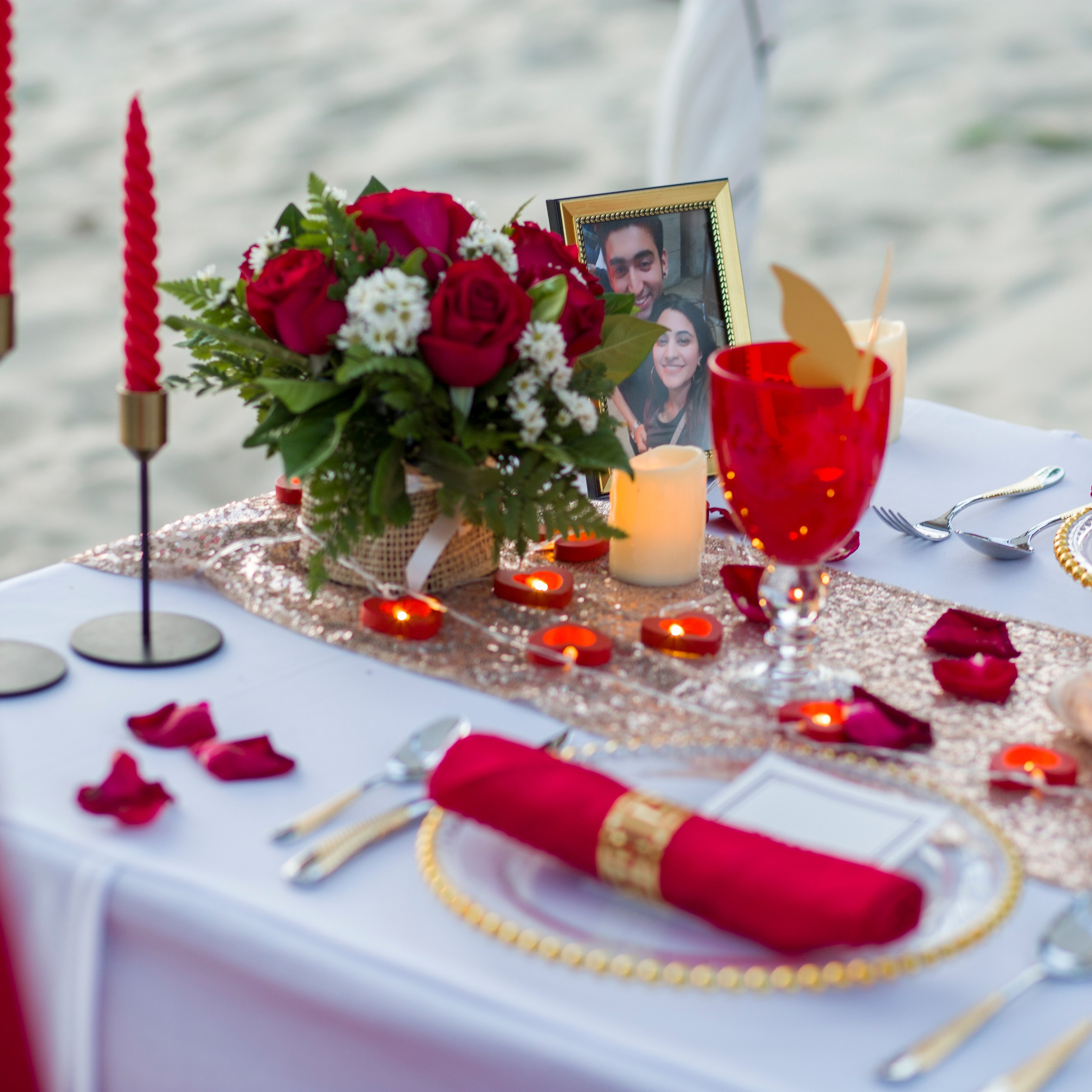 Luxury beach proposal in Koh Samui, Thailand. Private sunset setup with candles, flowers, and ocean view for an unforgettable engagement experience.