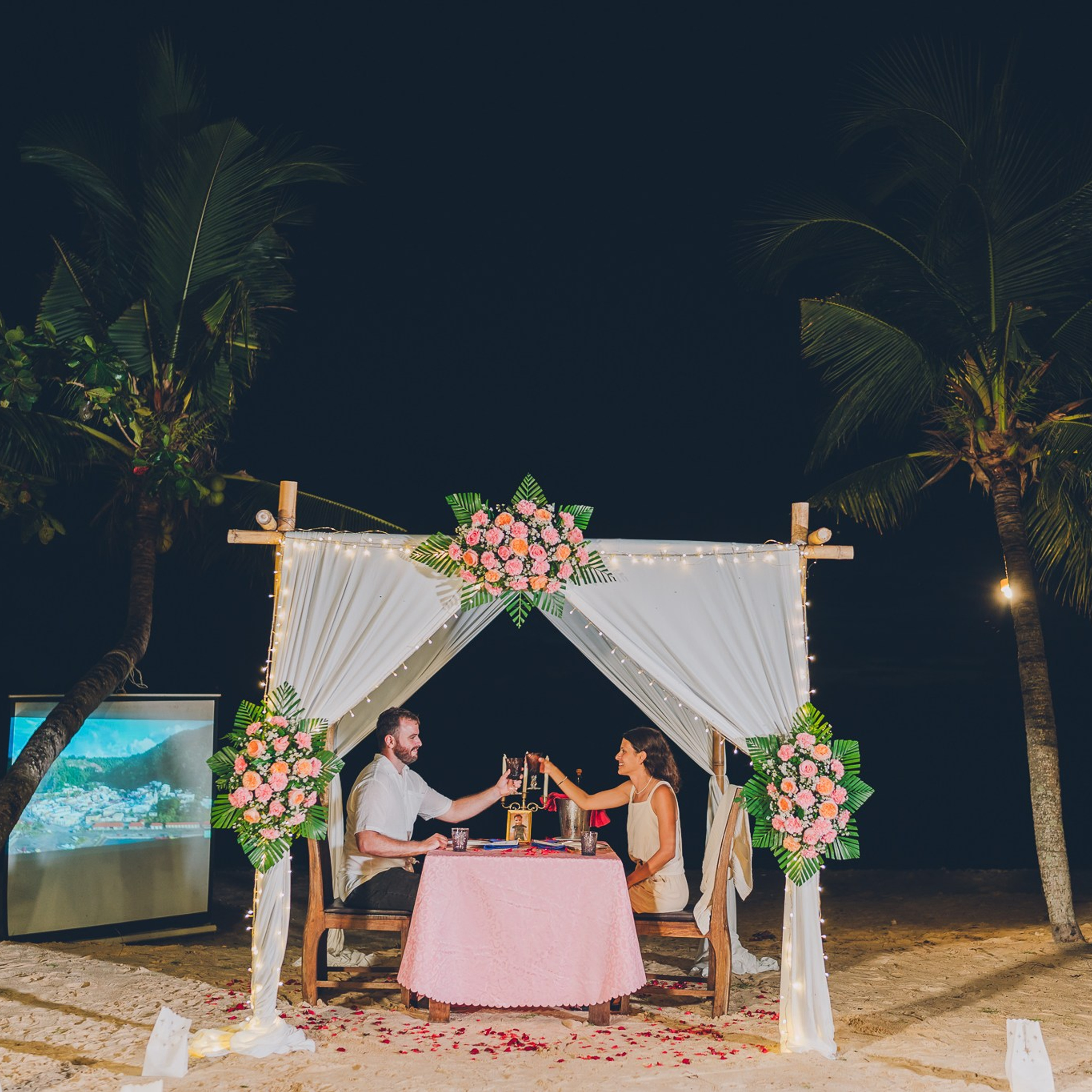 Luxury beach proposal in Koh Samui, Thailand. Private sunset setup with candles, flowers, and ocean view for an unforgettable engagement experience.
