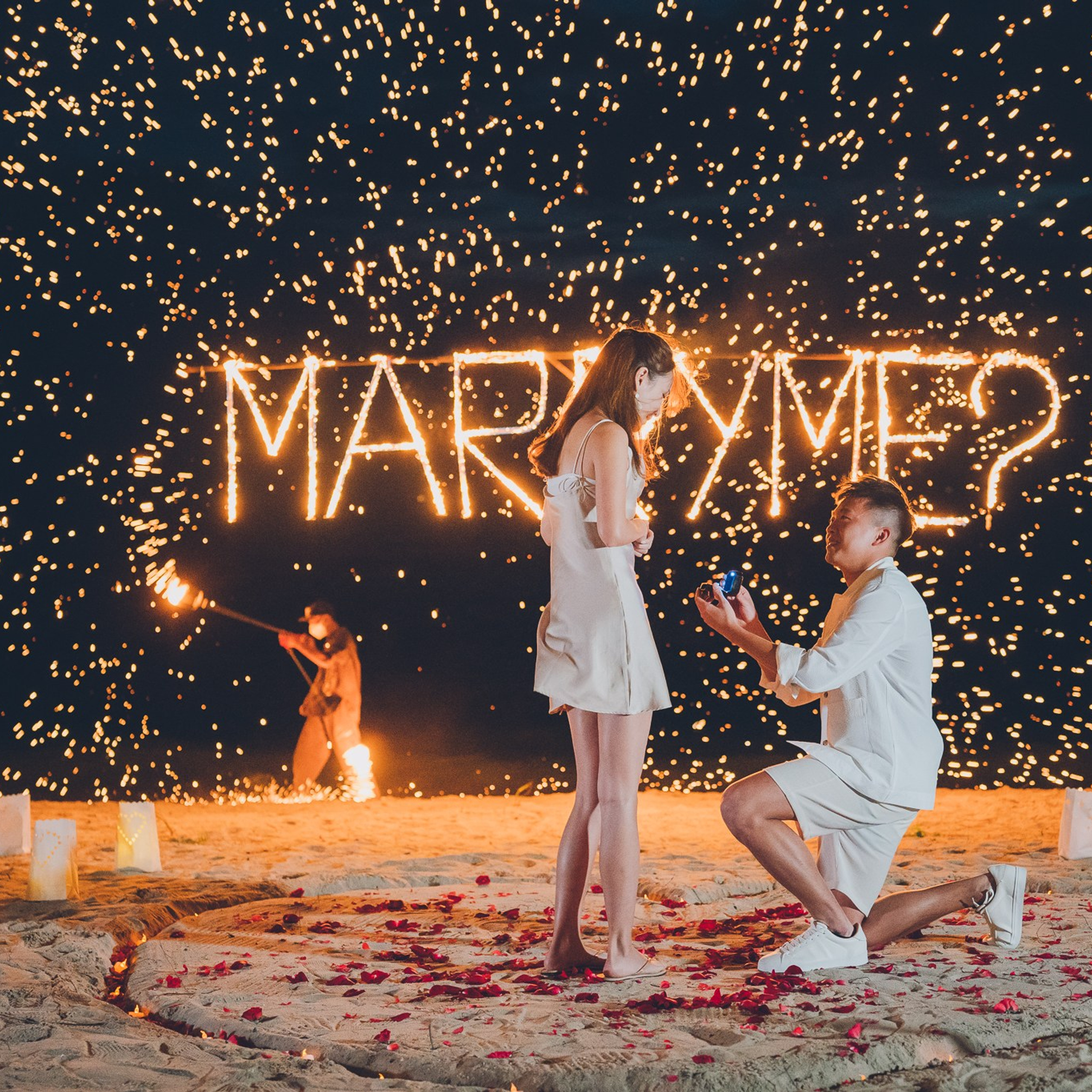 Luxury beach proposal in Koh Samui, Thailand. Private sunset setup with candles, flowers, and ocean view for an unforgettable engagement experience.