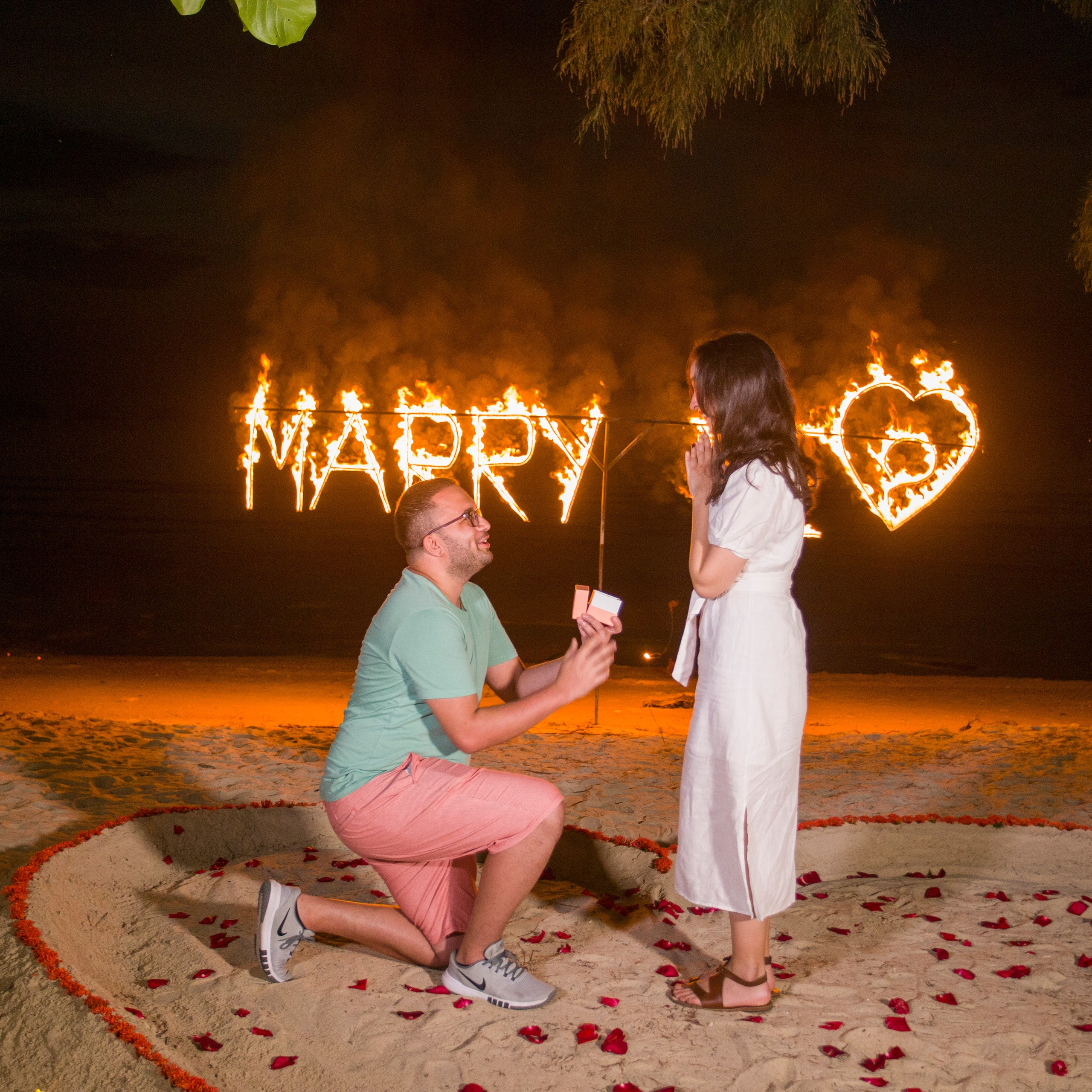 Luxury beach proposal in Koh Samui, Thailand. Private sunset setup with candles, flowers, and ocean view for an unforgettable engagement experience.