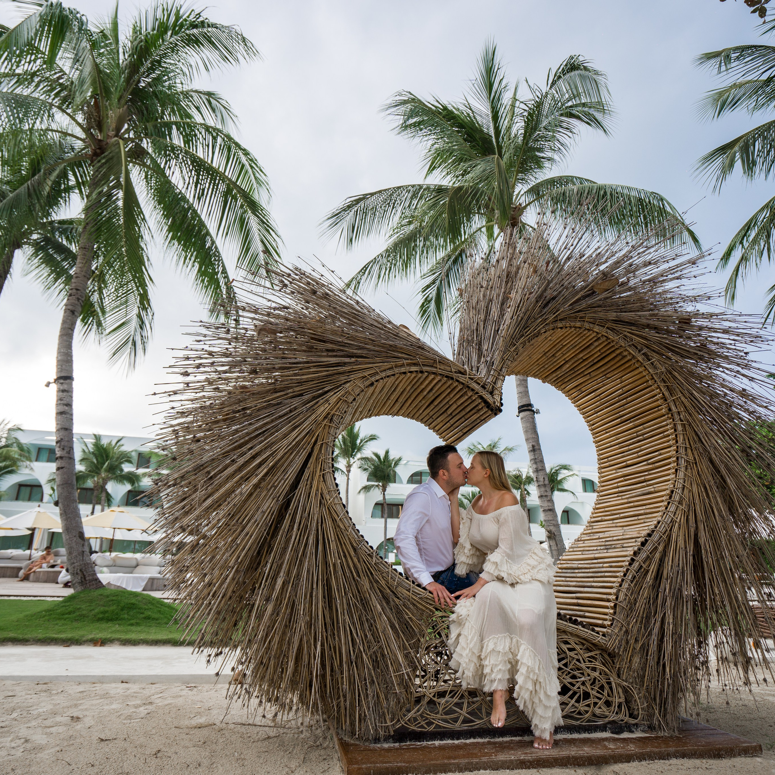 Luxury beach proposal in Koh Samui, Thailand. Private sunset setup with candles, flowers, and ocean view for an unforgettable engagement experience.