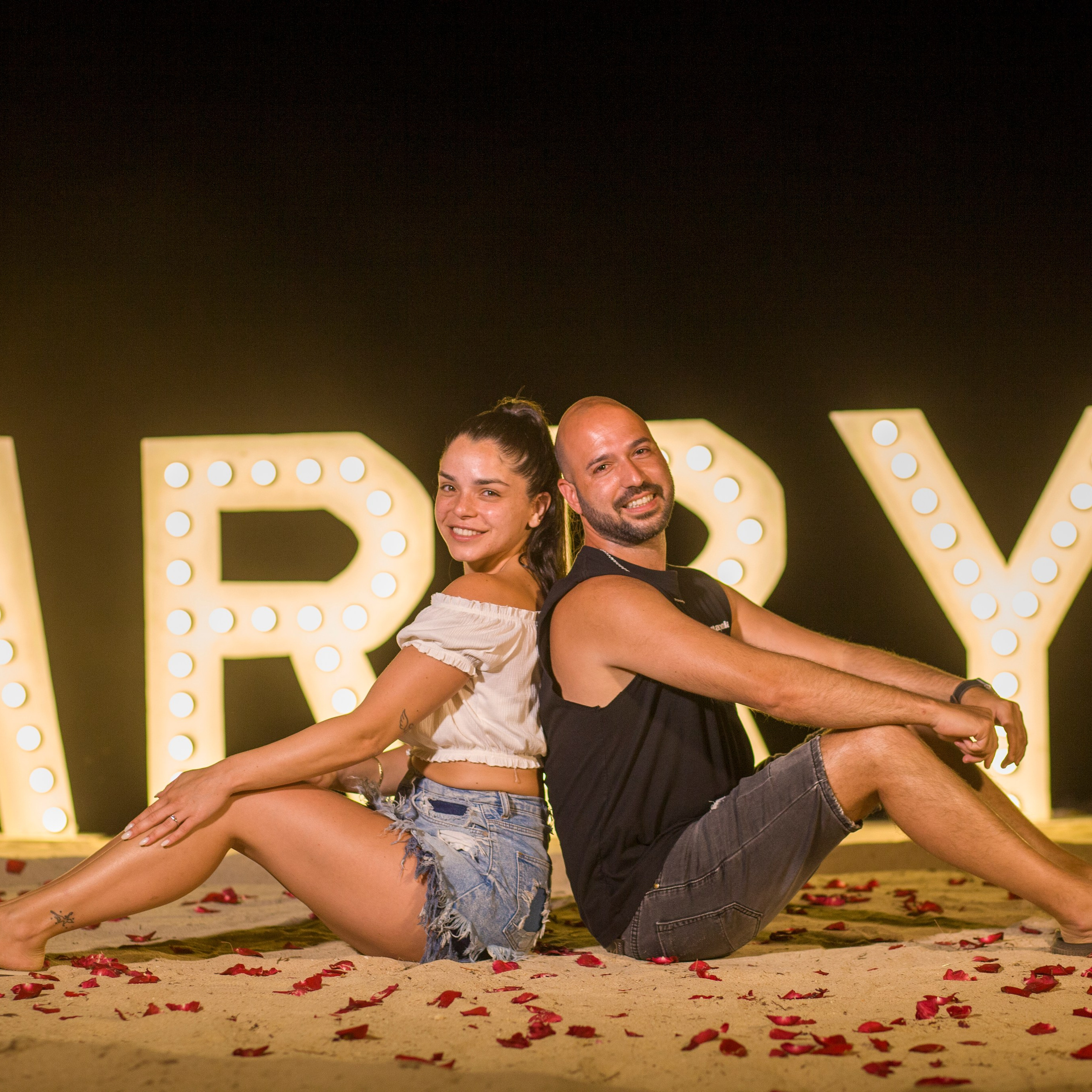 Luxury beach proposal in Koh Samui, Thailand. Private sunset setup with candles, flowers, and ocean view for an unforgettable engagement experience.