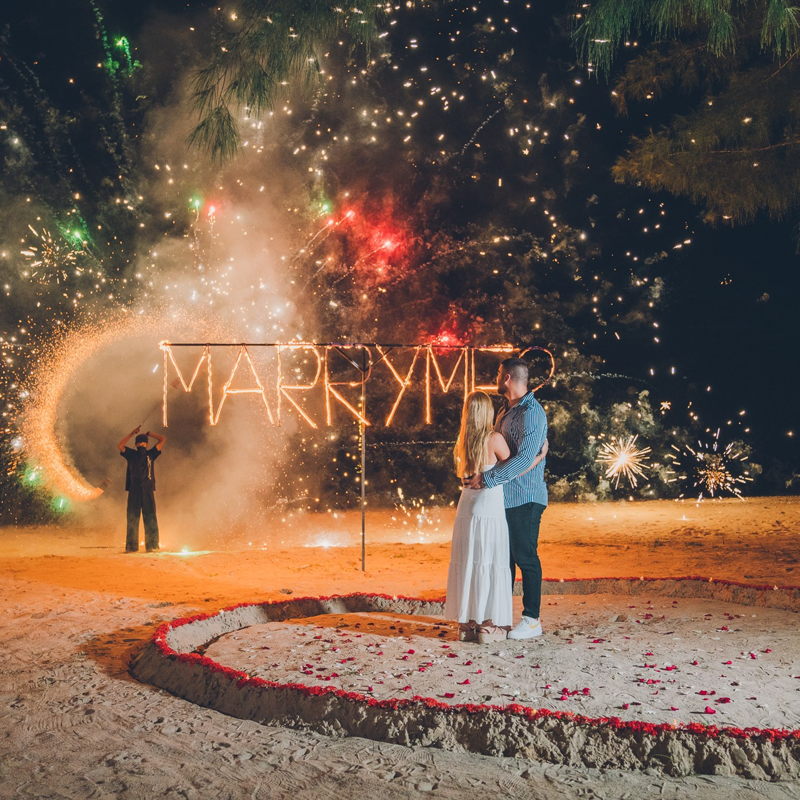 Luxury beach proposal in Koh Samui, Thailand. Private sunset setup with candles, flowers, and ocean view for an unforgettable engagement experience.