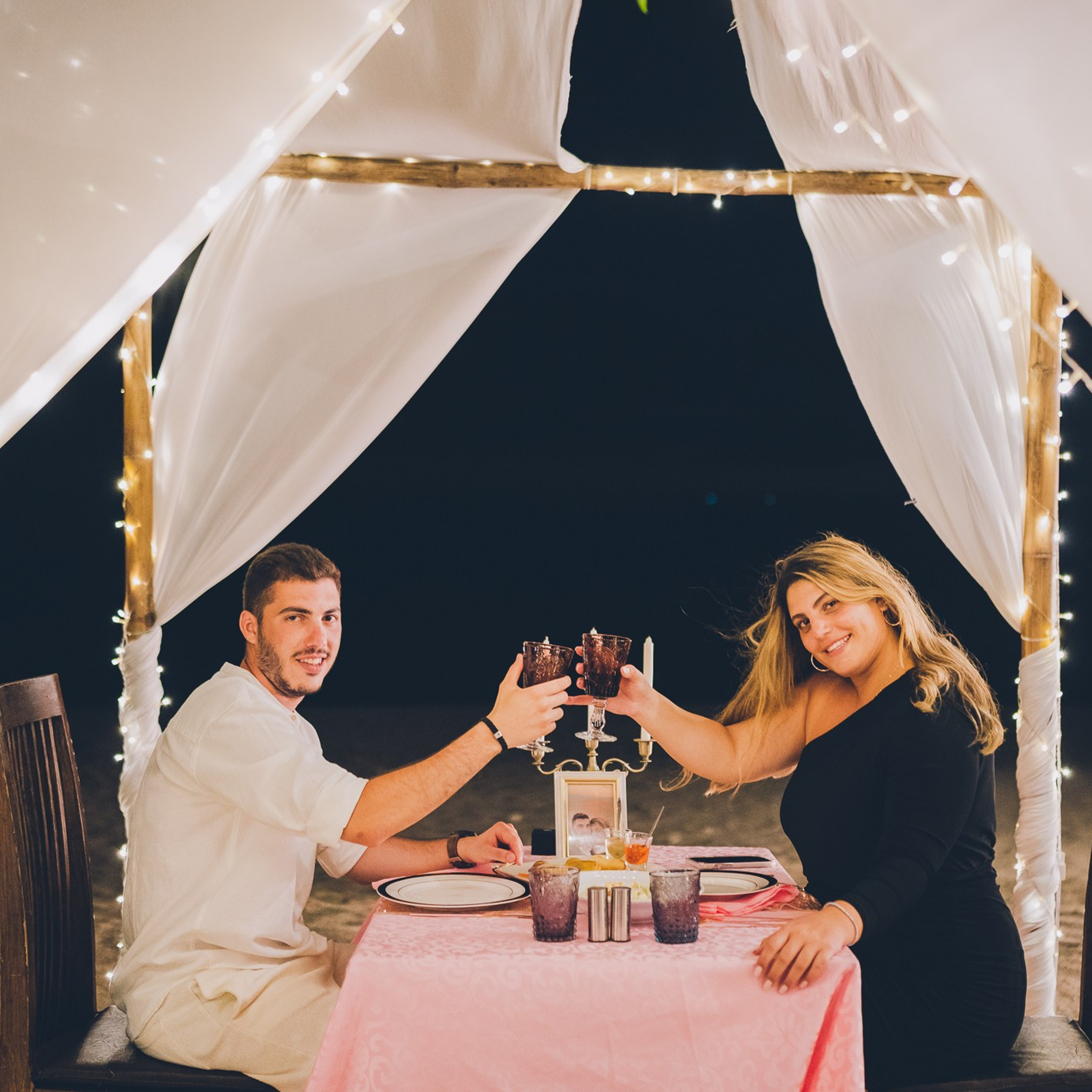 Luxury beach proposal in Koh Samui, Thailand. Private sunset setup with candles, flowers, and ocean view for an unforgettable engagement experience.