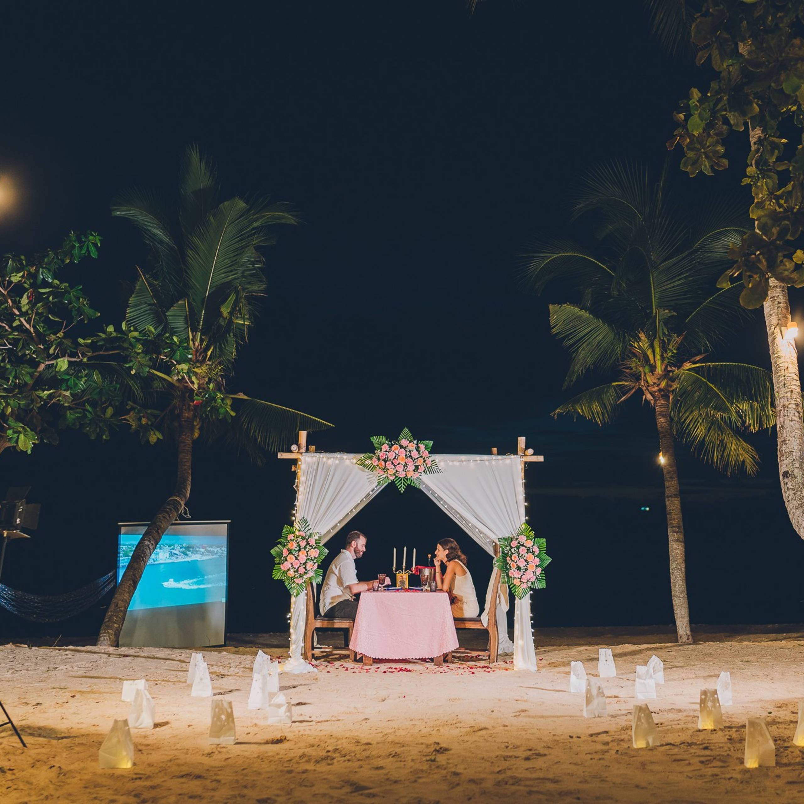 Luxury beach proposal in Koh Samui, Thailand. Private sunset setup with candles, flowers, and ocean view for an unforgettable engagement experience.