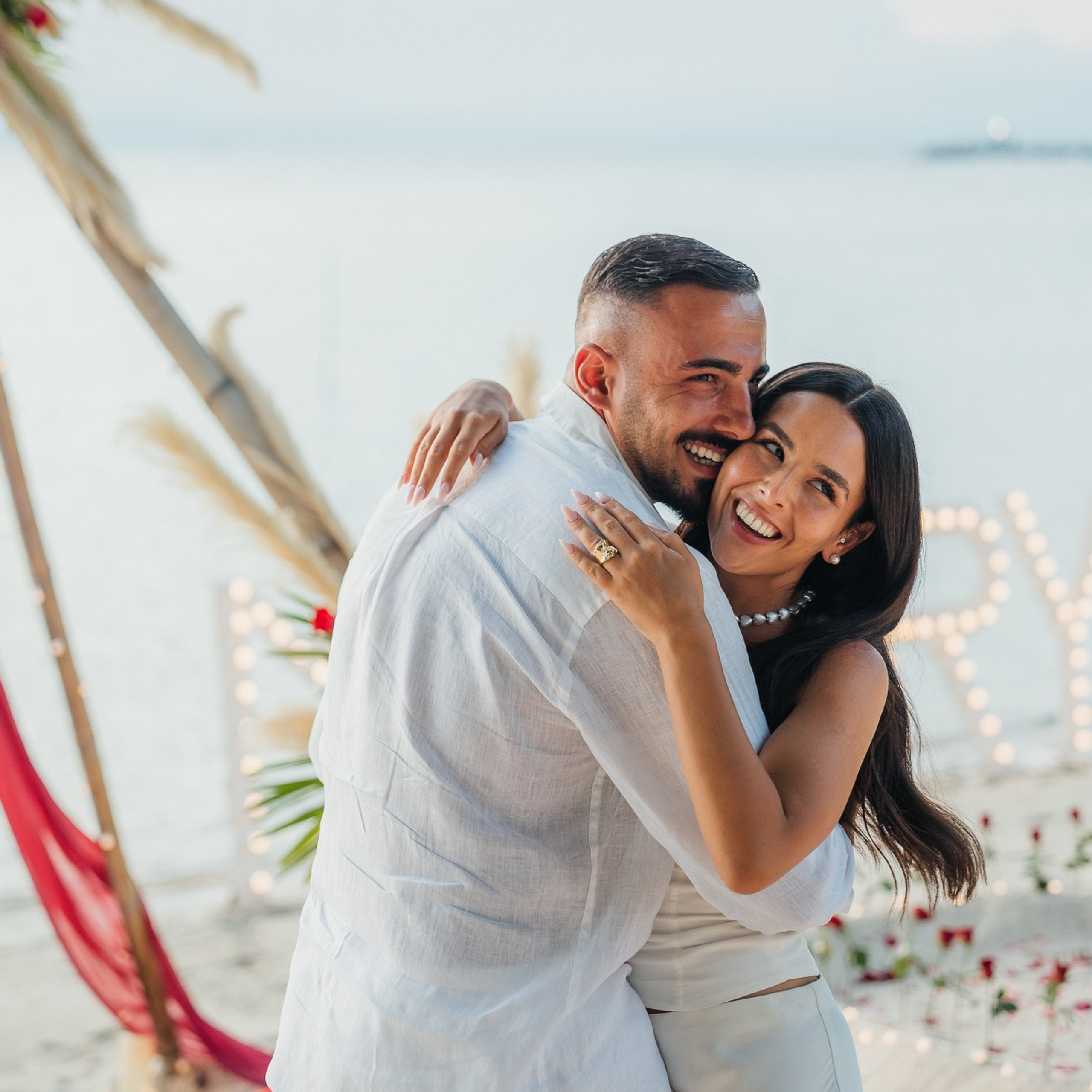 Luxury beach proposal in Koh Samui, Thailand. Private sunset setup with candles, flowers, and ocean view for an unforgettable engagement experience.