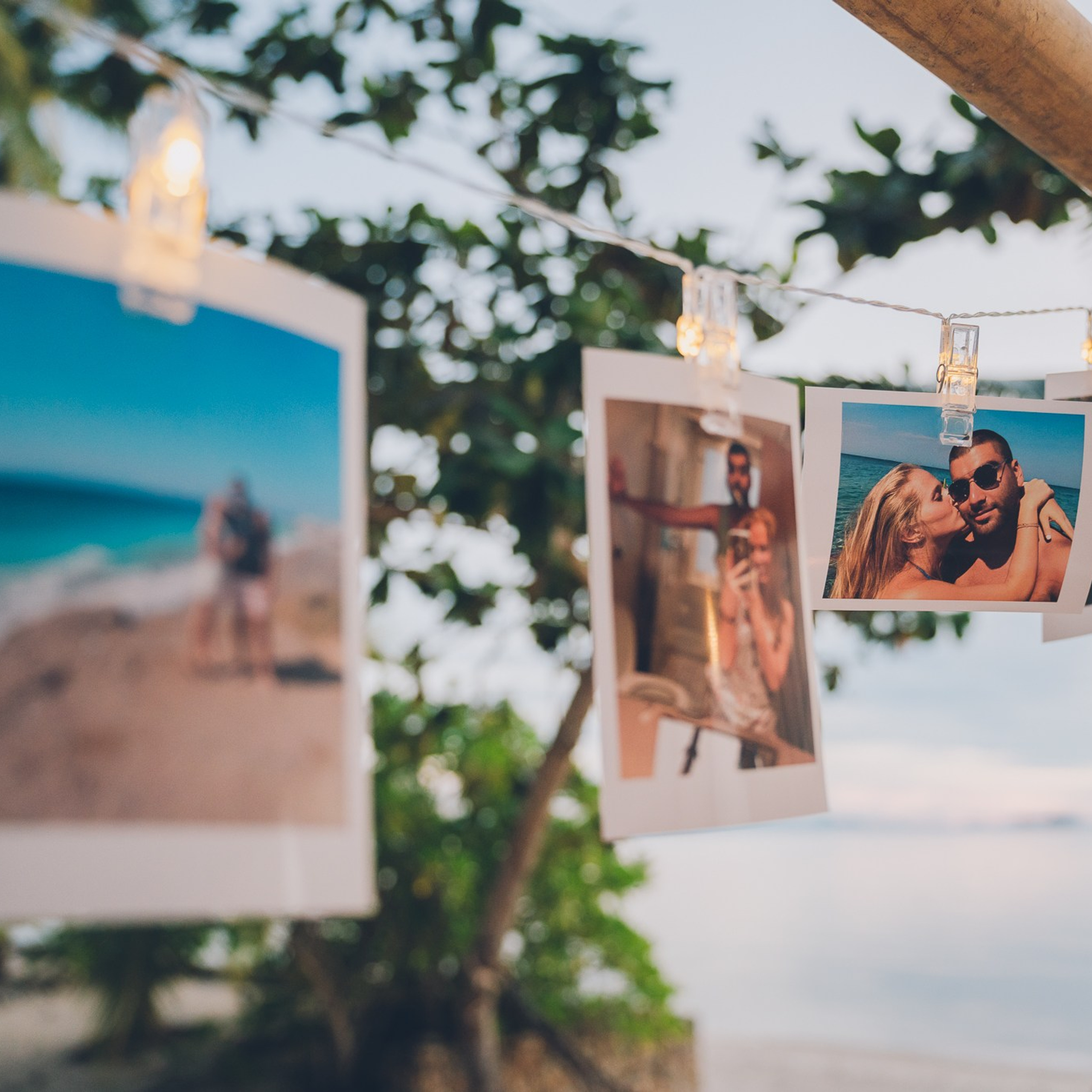 Romantic beach proposal setup in Koh Samui with candles and flower arch.