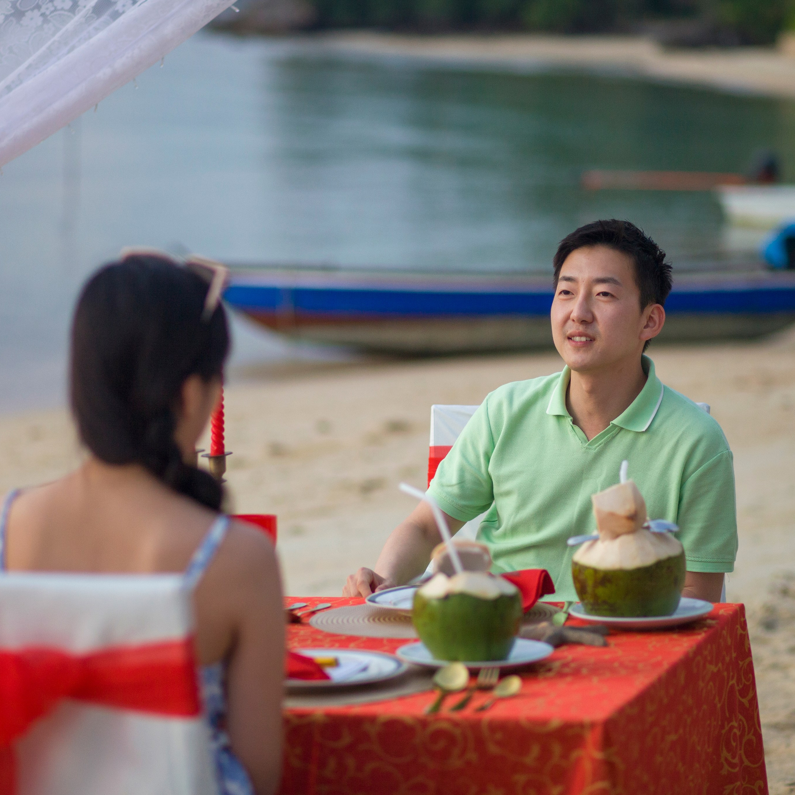 Luxury beach proposal in Koh Samui, Thailand. Private sunset setup with candles, flowers, and ocean view for an unforgettable engagement experience.