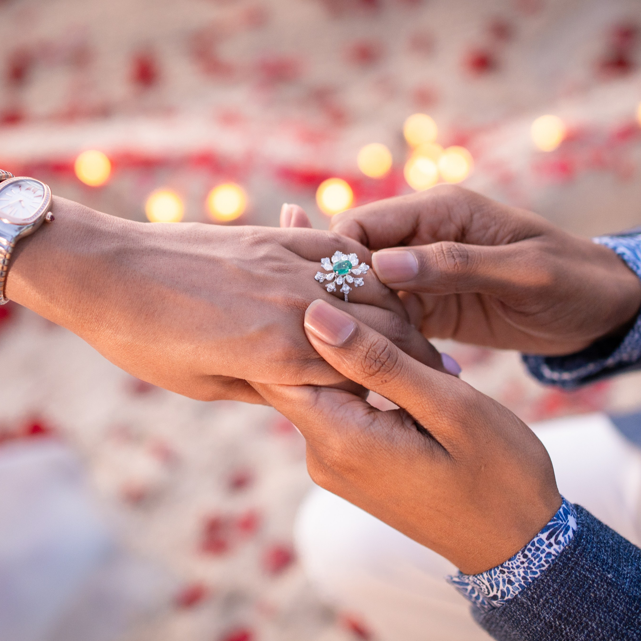 Romantic beach proposal setup in Koh Samui with candles and flower arch.