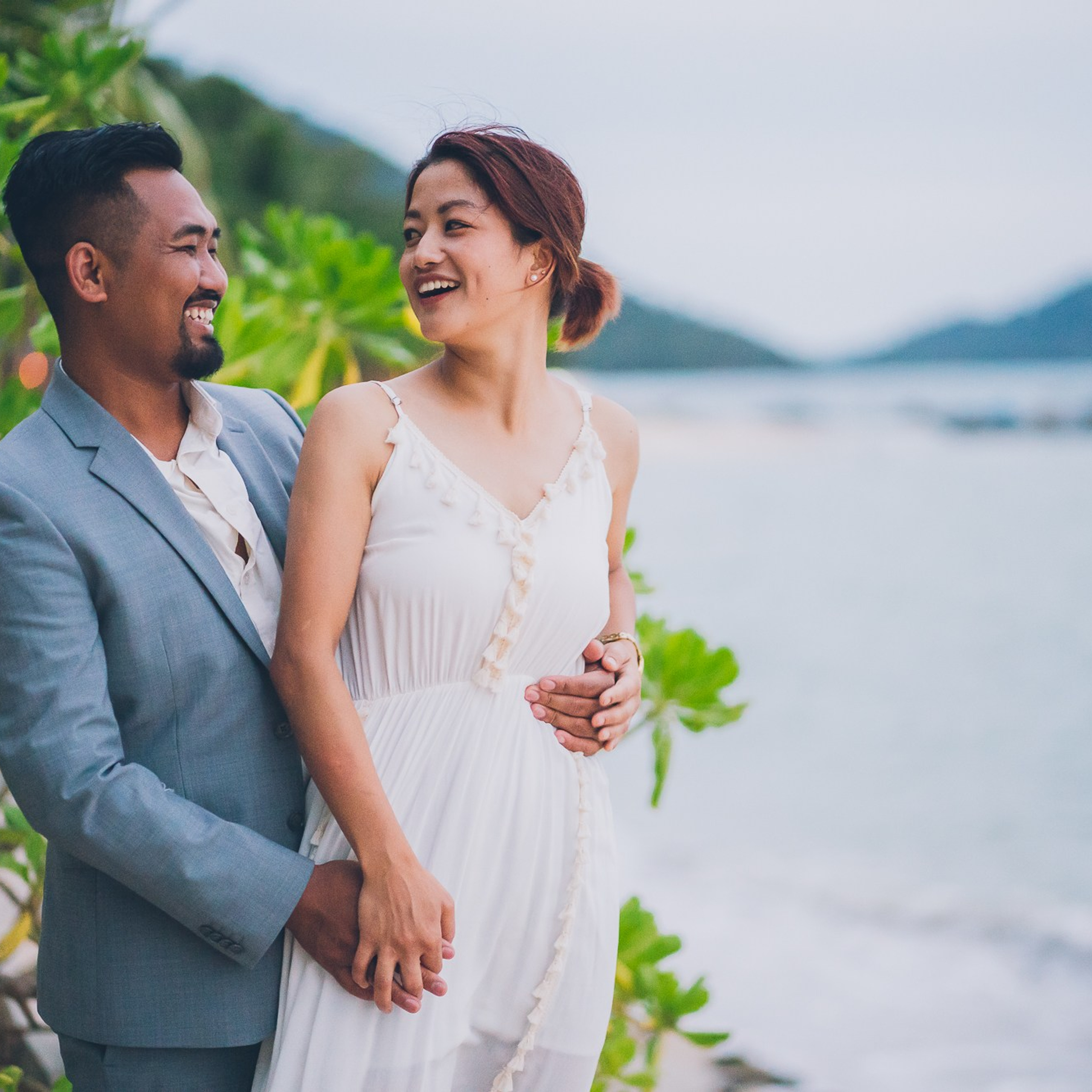 Luxury beach proposal in Koh Samui, Thailand. Private sunset setup with candles, flowers, and ocean view for an unforgettable engagement experience.