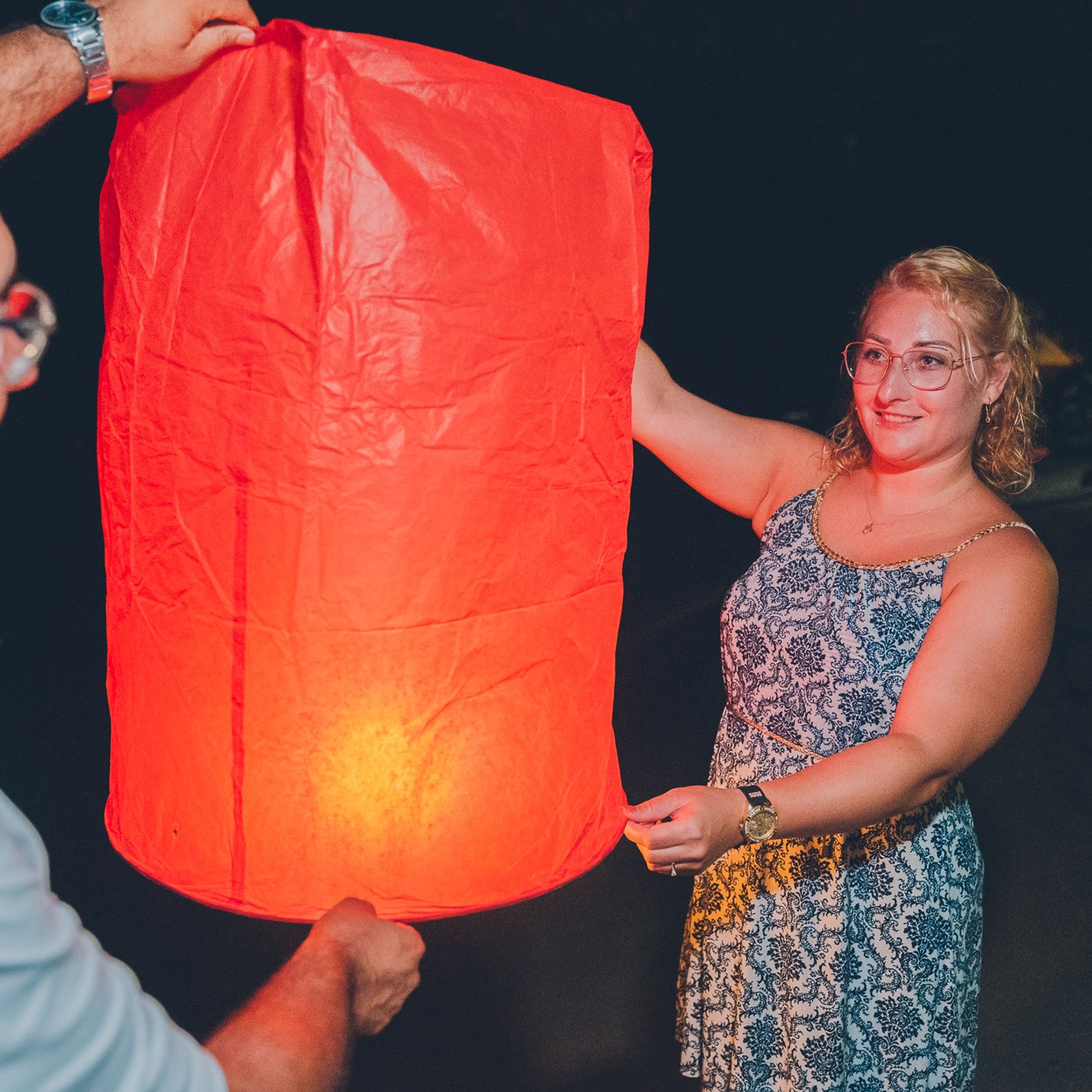 Romantic beach proposal setup in Koh Samui with candles and flower arch.