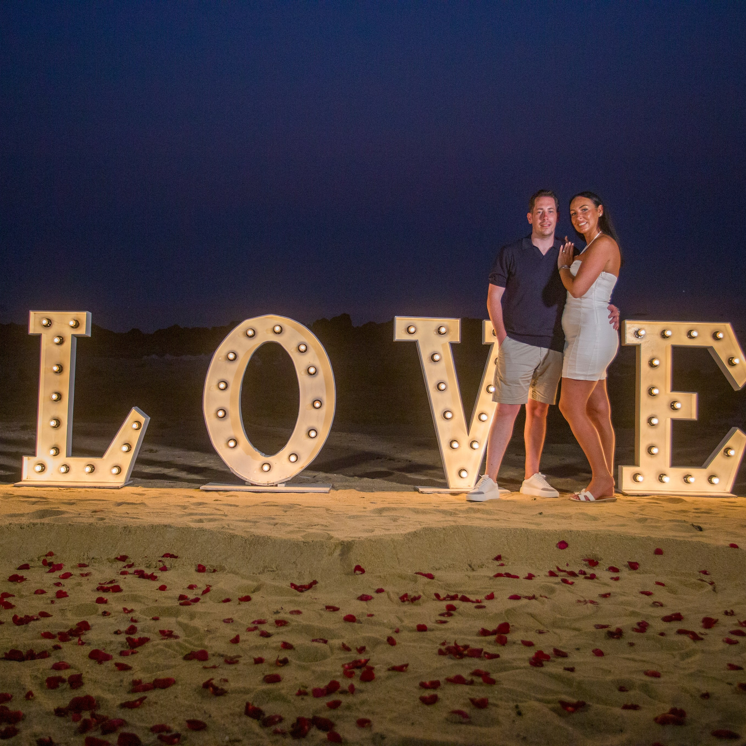Luxury beach proposal in Koh Samui, Thailand. Private sunset setup with candles, flowers, and ocean view for an unforgettable engagement experience.