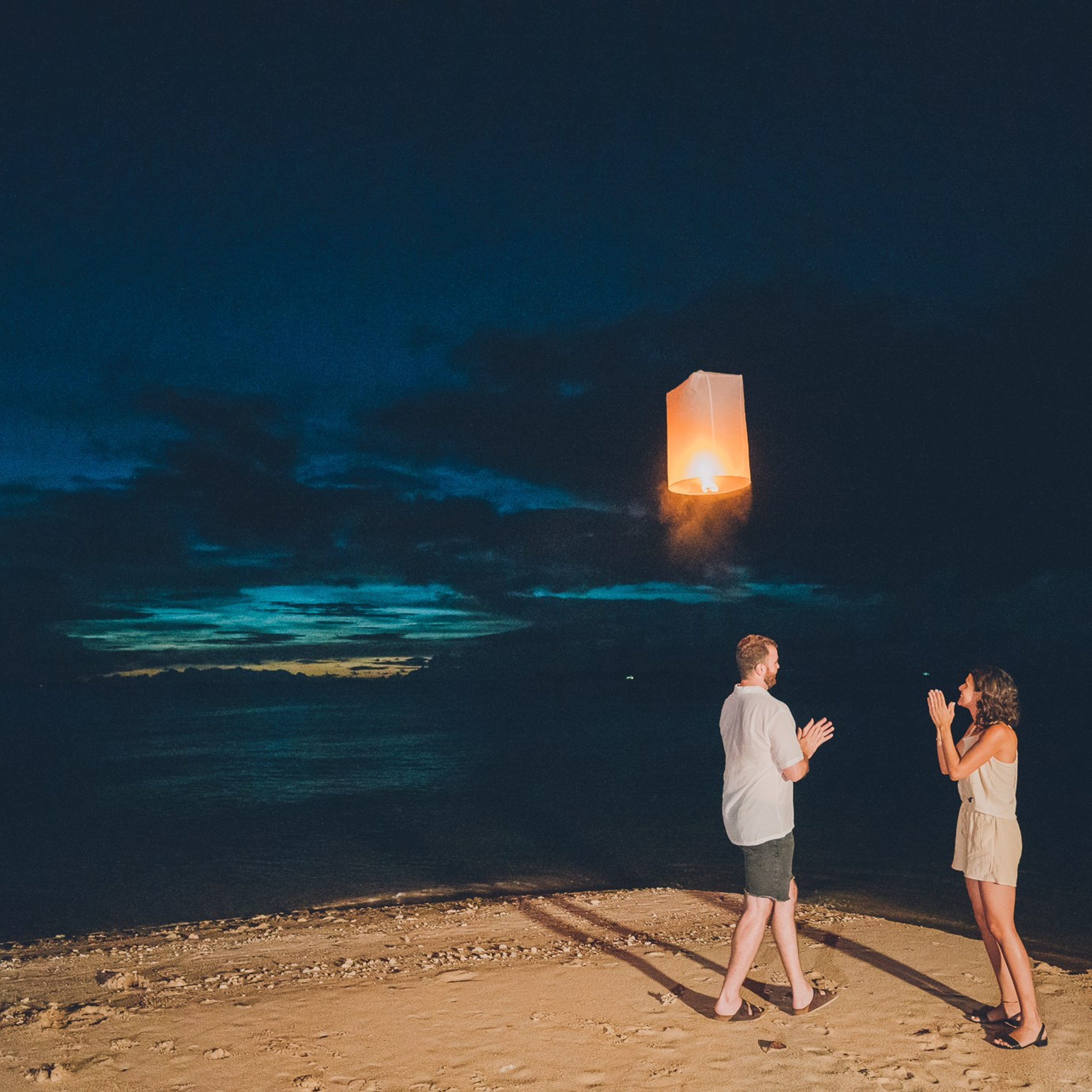 Luxury beach proposal in Koh Samui, Thailand. Private sunset setup with candles, flowers, and ocean view for an unforgettable engagement experience.