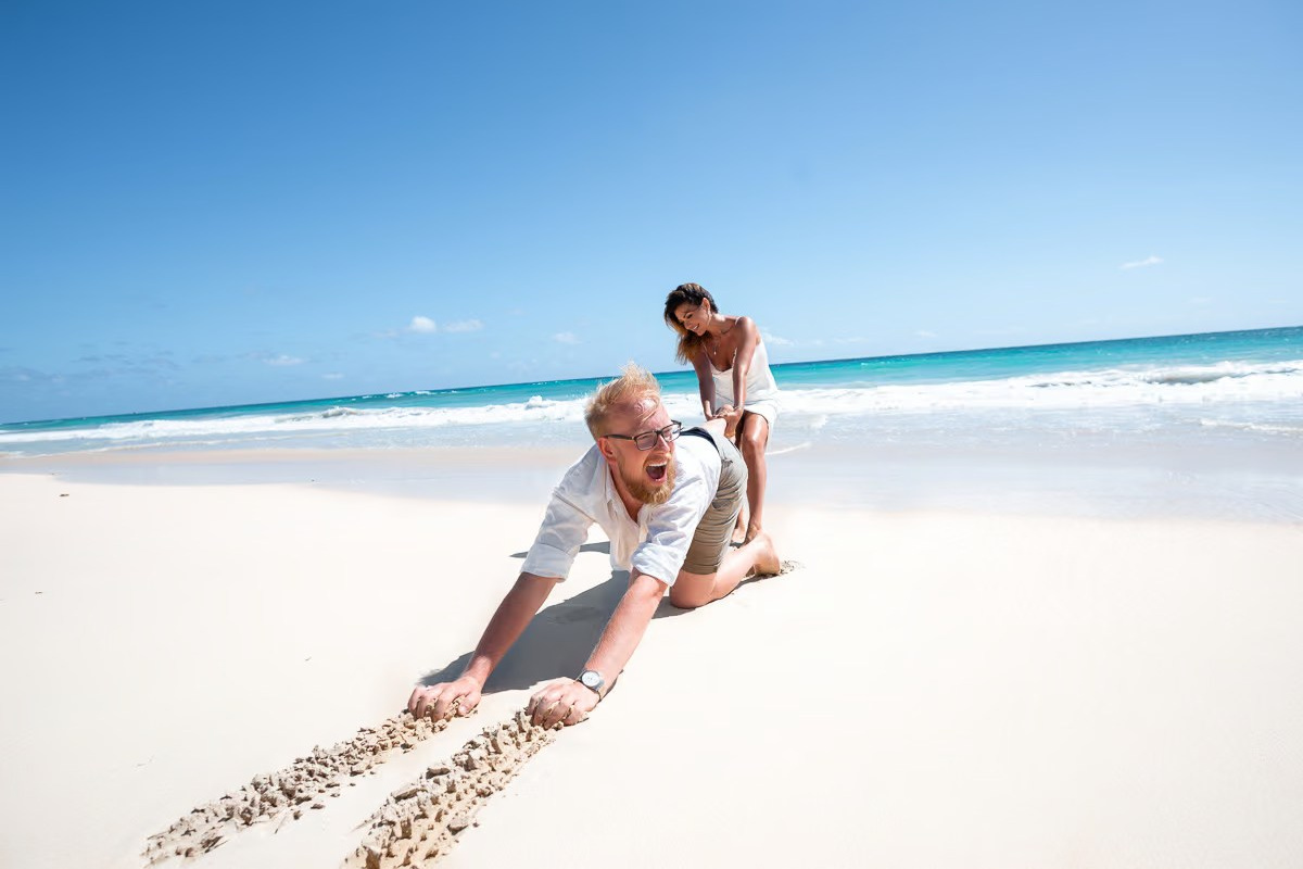 Romantic love story photoshoot for newlyweds on the wild Macao Beach in the Dominican Republic.