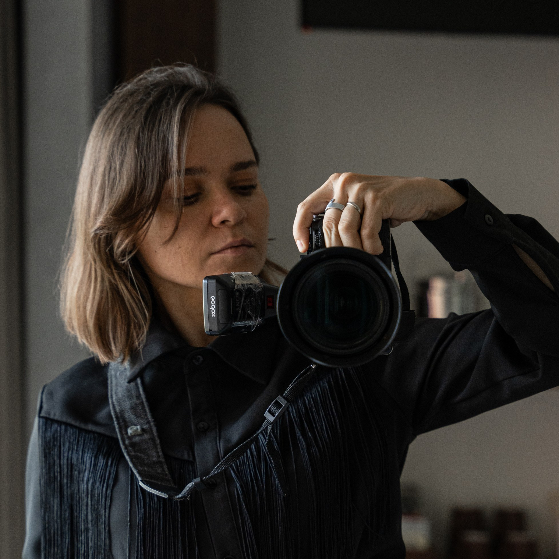 Corporate event photographer capturing professional moments with a camera.