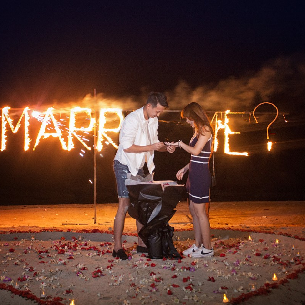 Luxury beach proposal in Koh Samui, Thailand. Private sunset setup with candles, flowers, and ocean view for an unforgettable engagement experience.