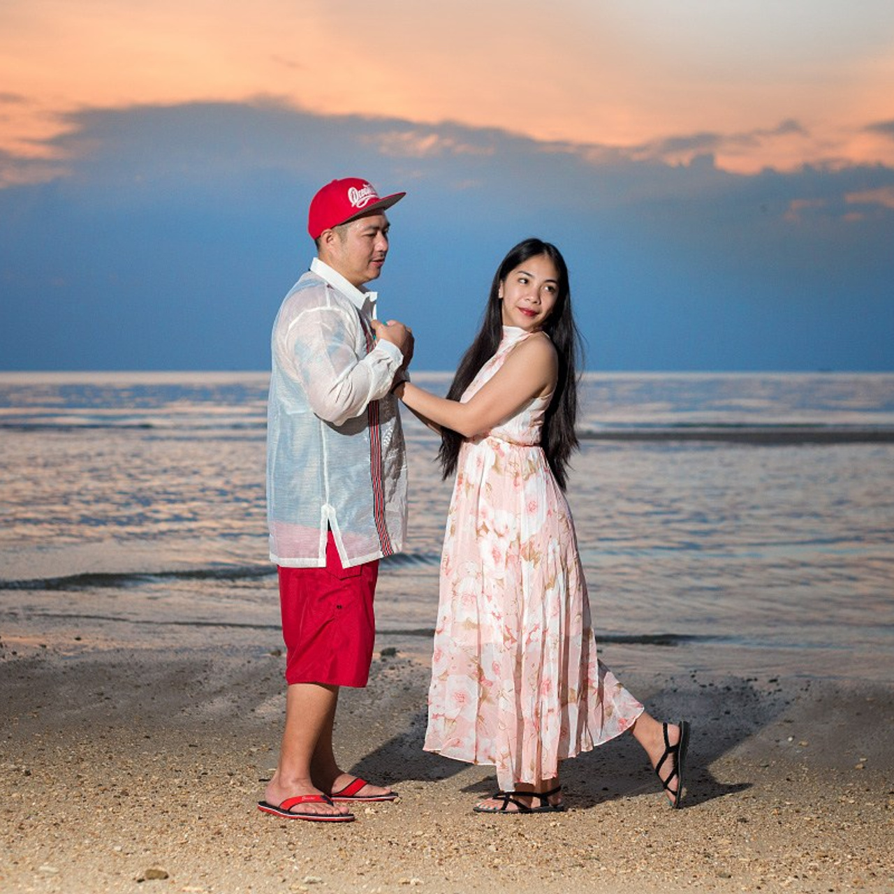 Romantic beach proposal setup in Koh Samui with candles and flower arch.