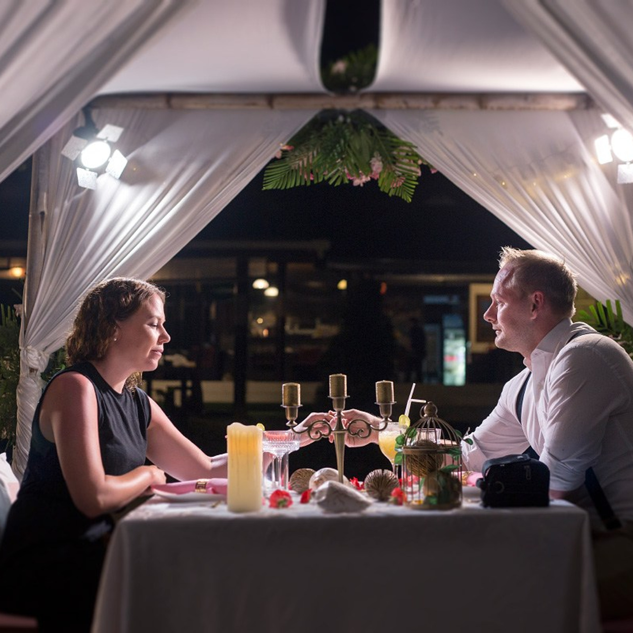 Luxury beach proposal in Koh Samui, Thailand. Private sunset setup with candles, flowers, and ocean view for an unforgettable engagement experience.