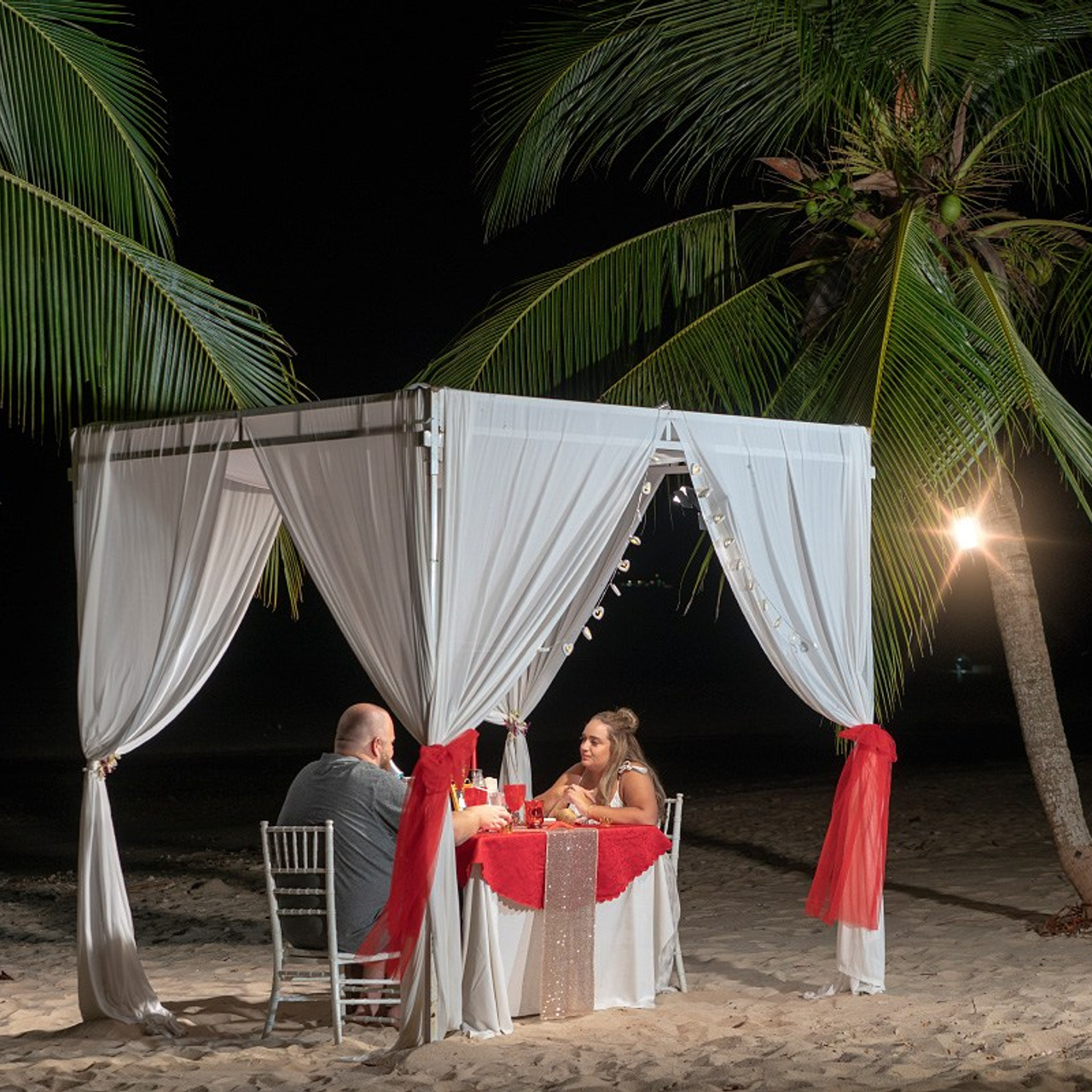 Luxury beach proposal in Koh Samui, Thailand. Private sunset setup with candles, flowers, and ocean view for an unforgettable engagement experience.