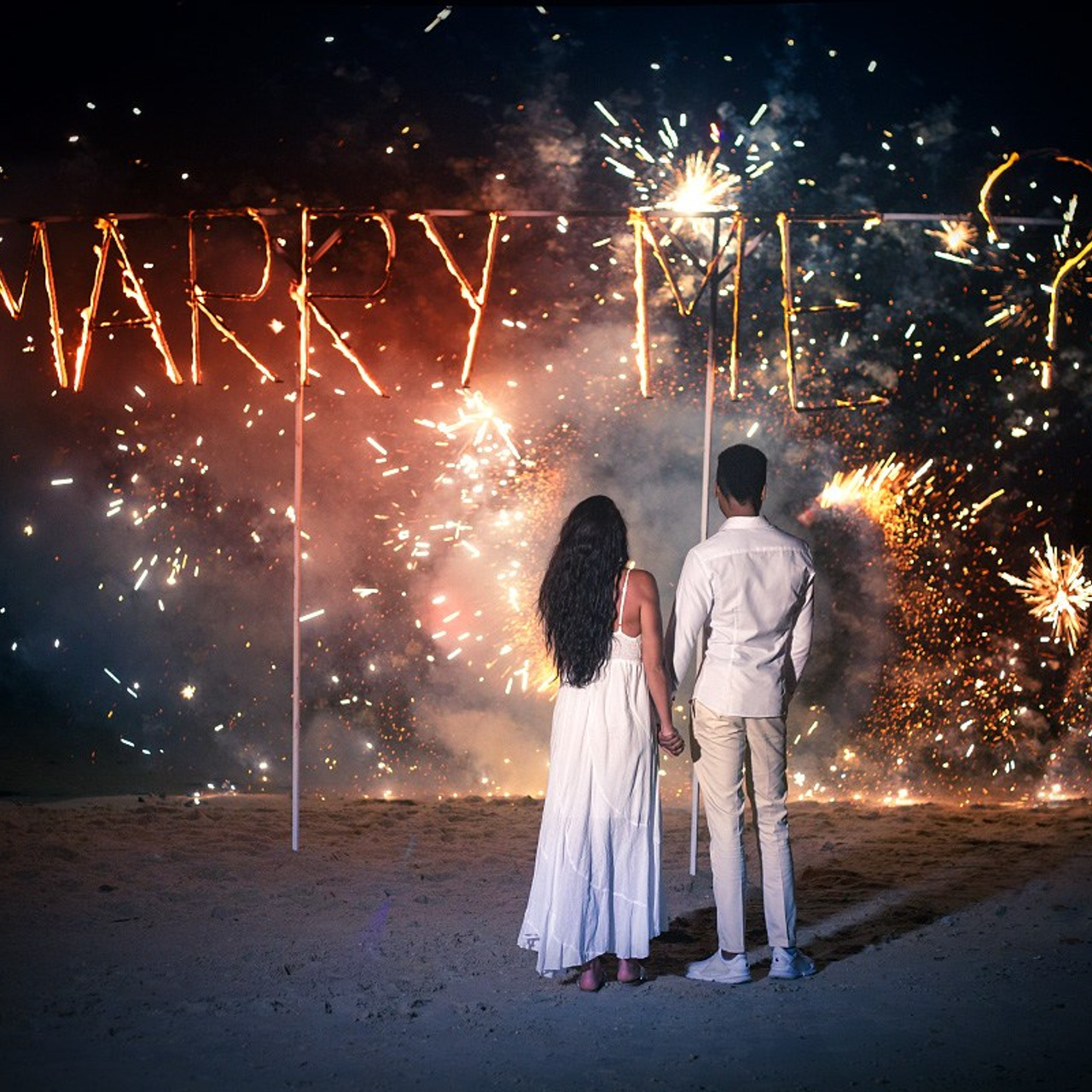 Luxury beach proposal in Koh Samui, Thailand. Private sunset setup with candles, flowers, and ocean view for an unforgettable engagement experience.
