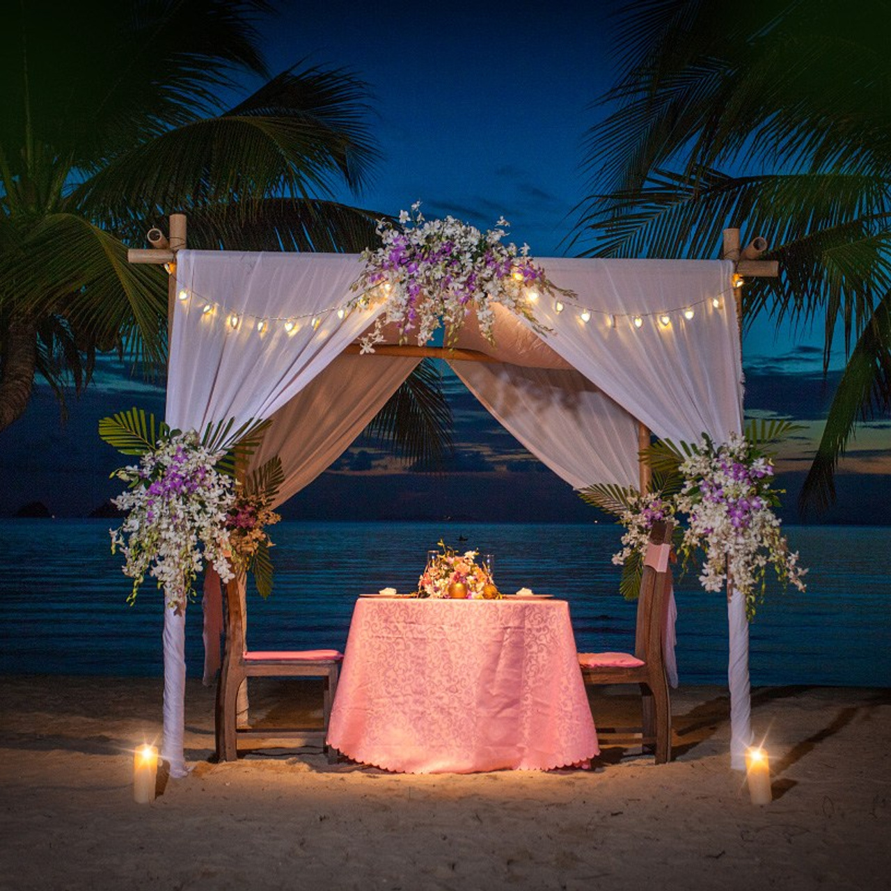 Luxury beach proposal in Koh Samui, Thailand. Private sunset setup with candles, flowers, and ocean view for an unforgettable engagement experience.