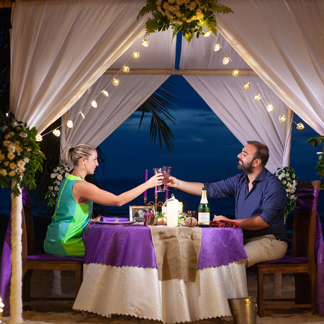 Luxury beach proposal in Koh Samui, Thailand. Private sunset setup with candles, flowers, and ocean view for an unforgettable engagement experience.