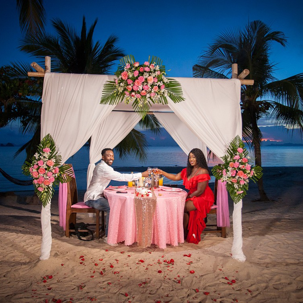 Luxury beach proposal in Koh Samui, Thailand. Private sunset setup with candles, flowers, and ocean view for an unforgettable engagement experience.