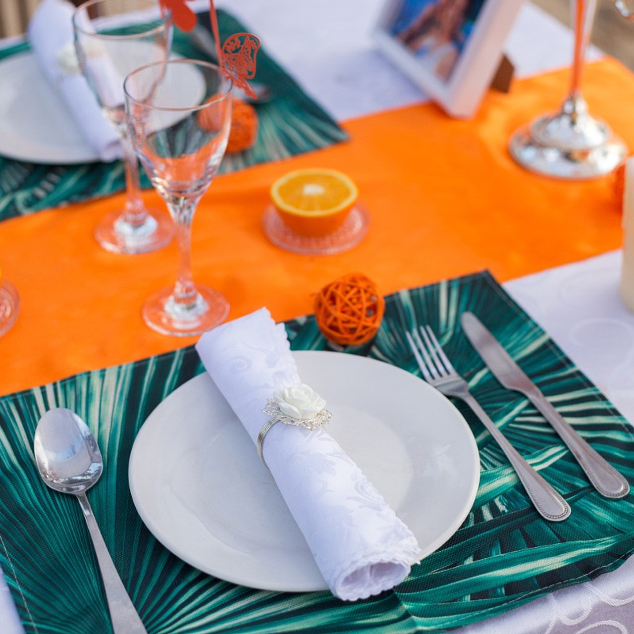 Romantic beach proposal setup in Koh Samui with candles and flower arch.
