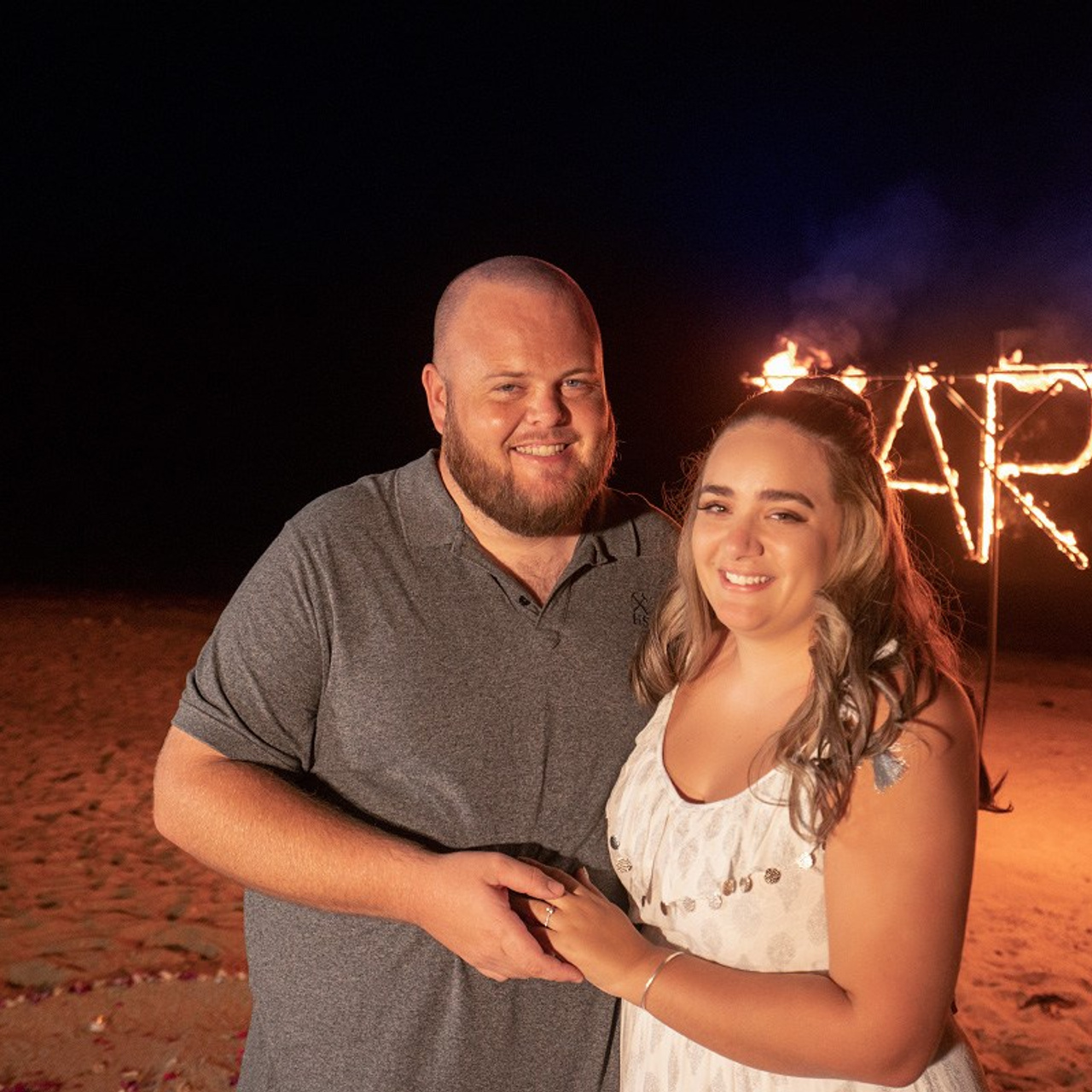 Luxury beach proposal in Koh Samui, Thailand. Private sunset setup with candles, flowers, and ocean view for an unforgettable engagement experience.