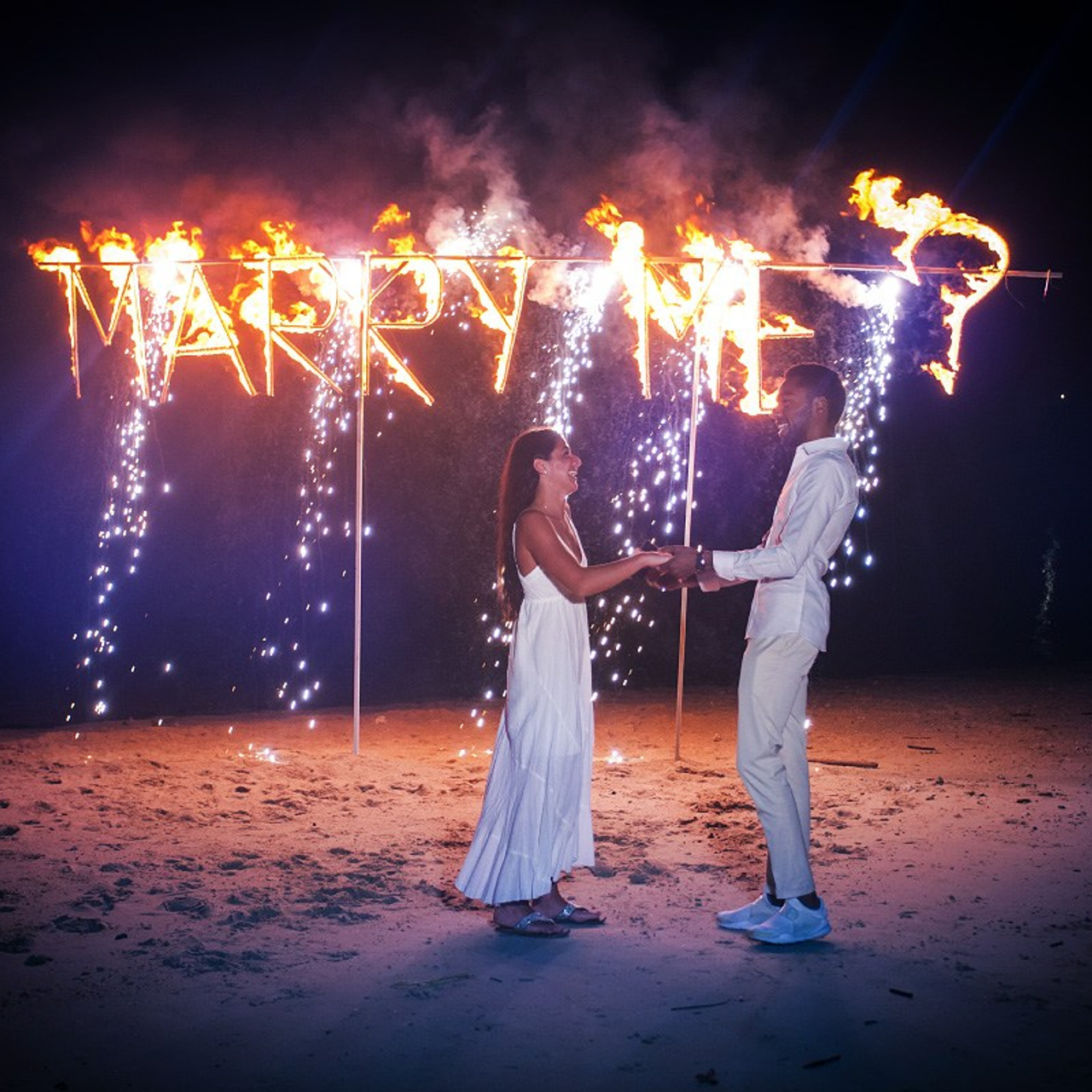 Luxury beach proposal in Koh Samui, Thailand. Private sunset setup with candles, flowers, and ocean view for an unforgettable engagement experience.
