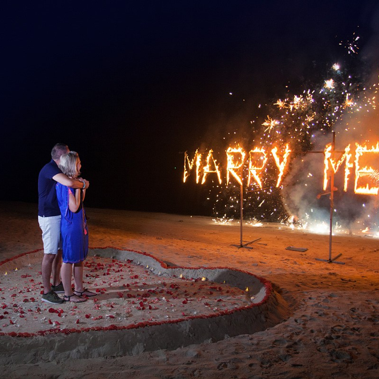 Luxury beach proposal in Koh Samui, Thailand. Private sunset setup with candles, flowers, and ocean view for an unforgettable engagement experience.