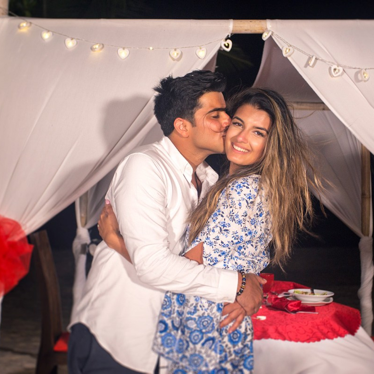 Luxury beach proposal in Koh Samui, Thailand. Private sunset setup with candles, flowers, and ocean view for an unforgettable engagement experience.