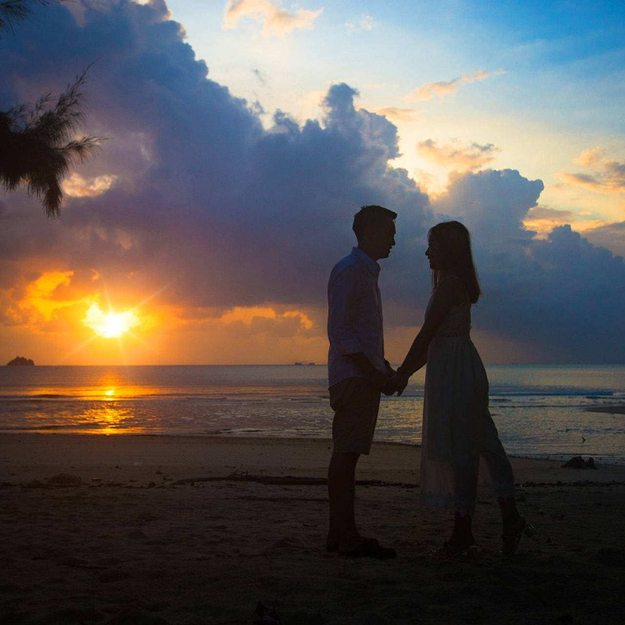 Luxury beach proposal in Koh Samui, Thailand. Private sunset setup with candles, flowers, and ocean view for an unforgettable engagement experience.