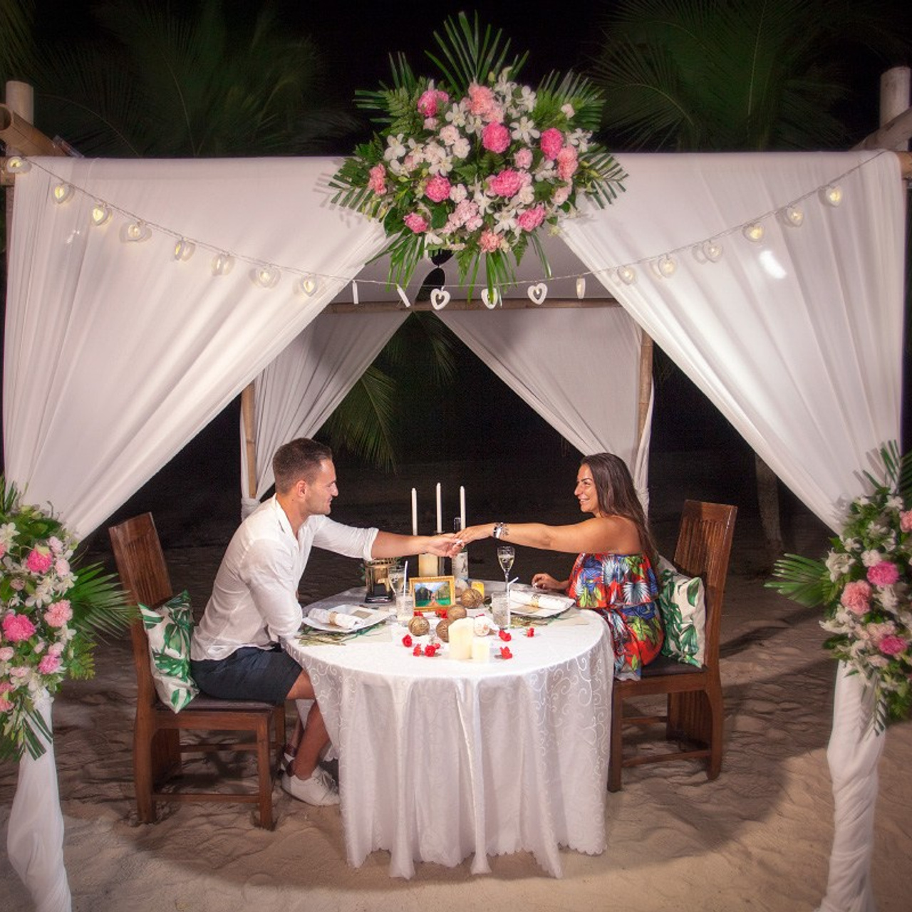 Luxury beach proposal in Koh Samui, Thailand. Private sunset setup with candles, flowers, and ocean view for an unforgettable engagement experience.
