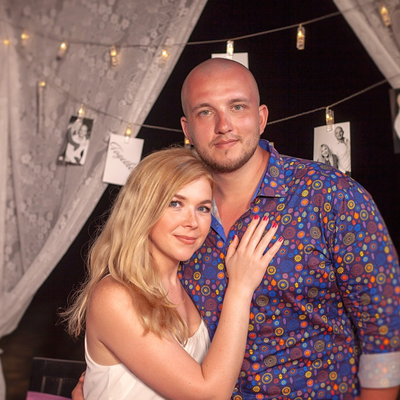 Romantic beach proposal setup in Koh Samui with candles and flower arch.