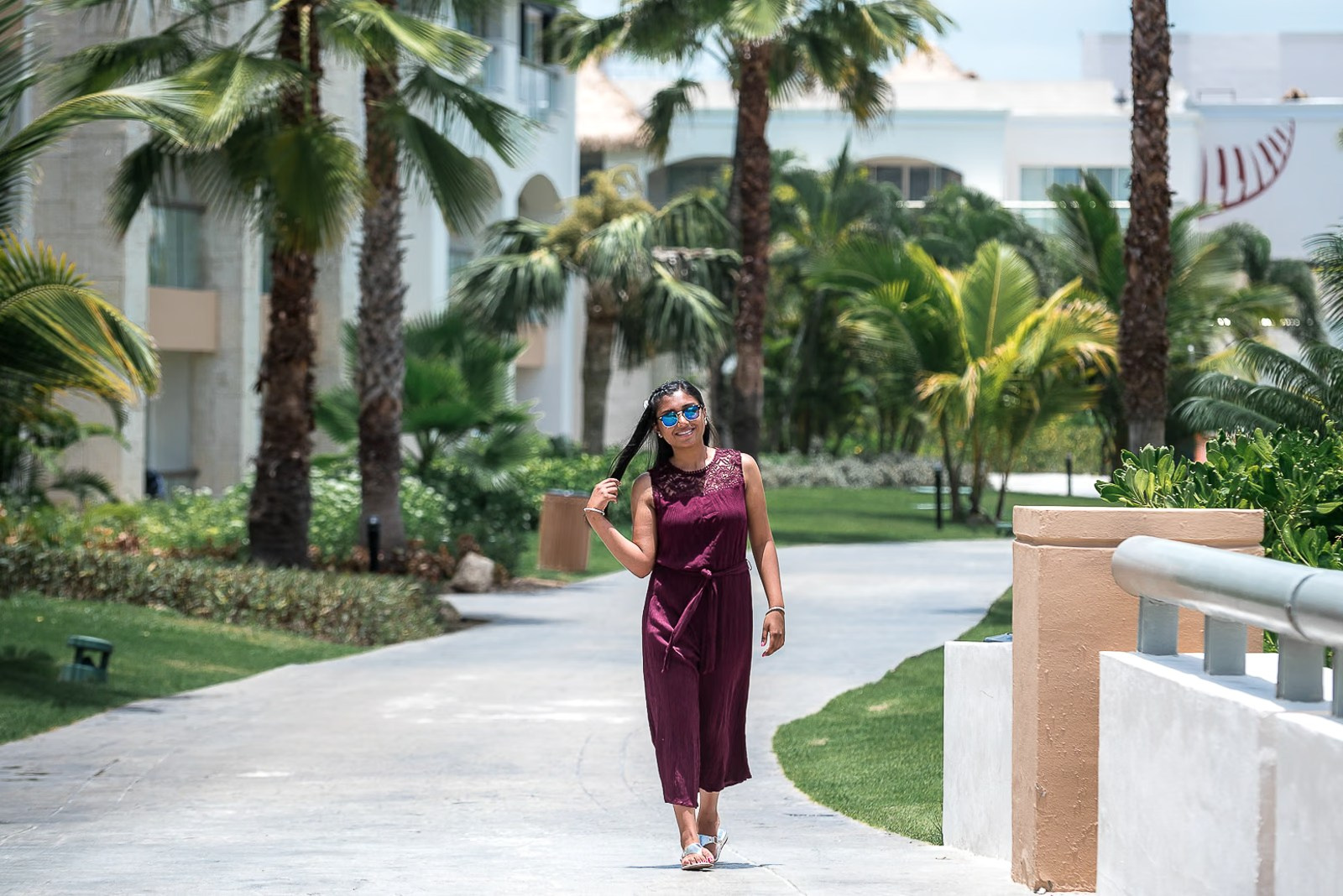 Woman walking around the Hard Rock Punta Cana resort during a photoshoot