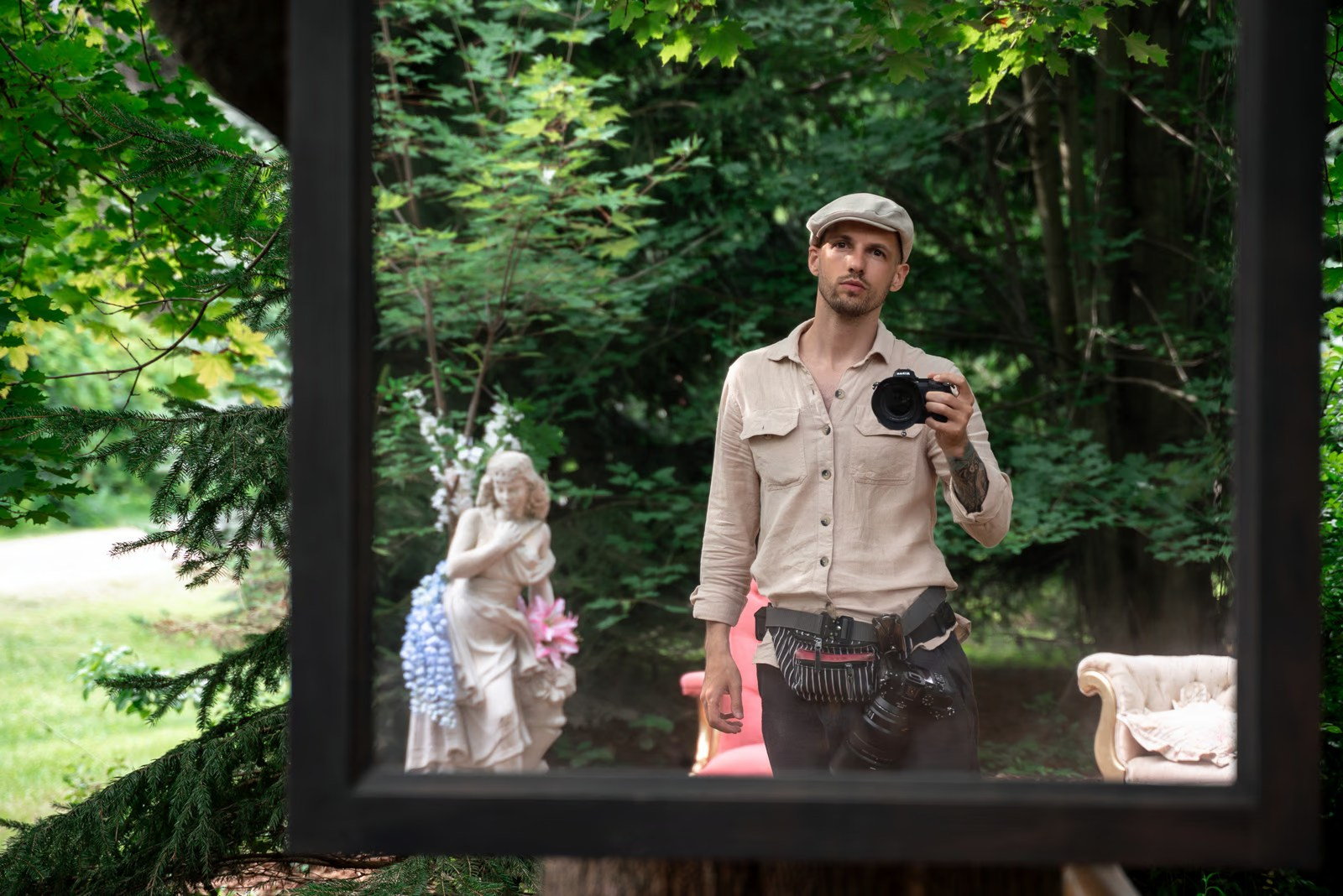 Photographer Alex Po takes a mirror selfie at a wedding