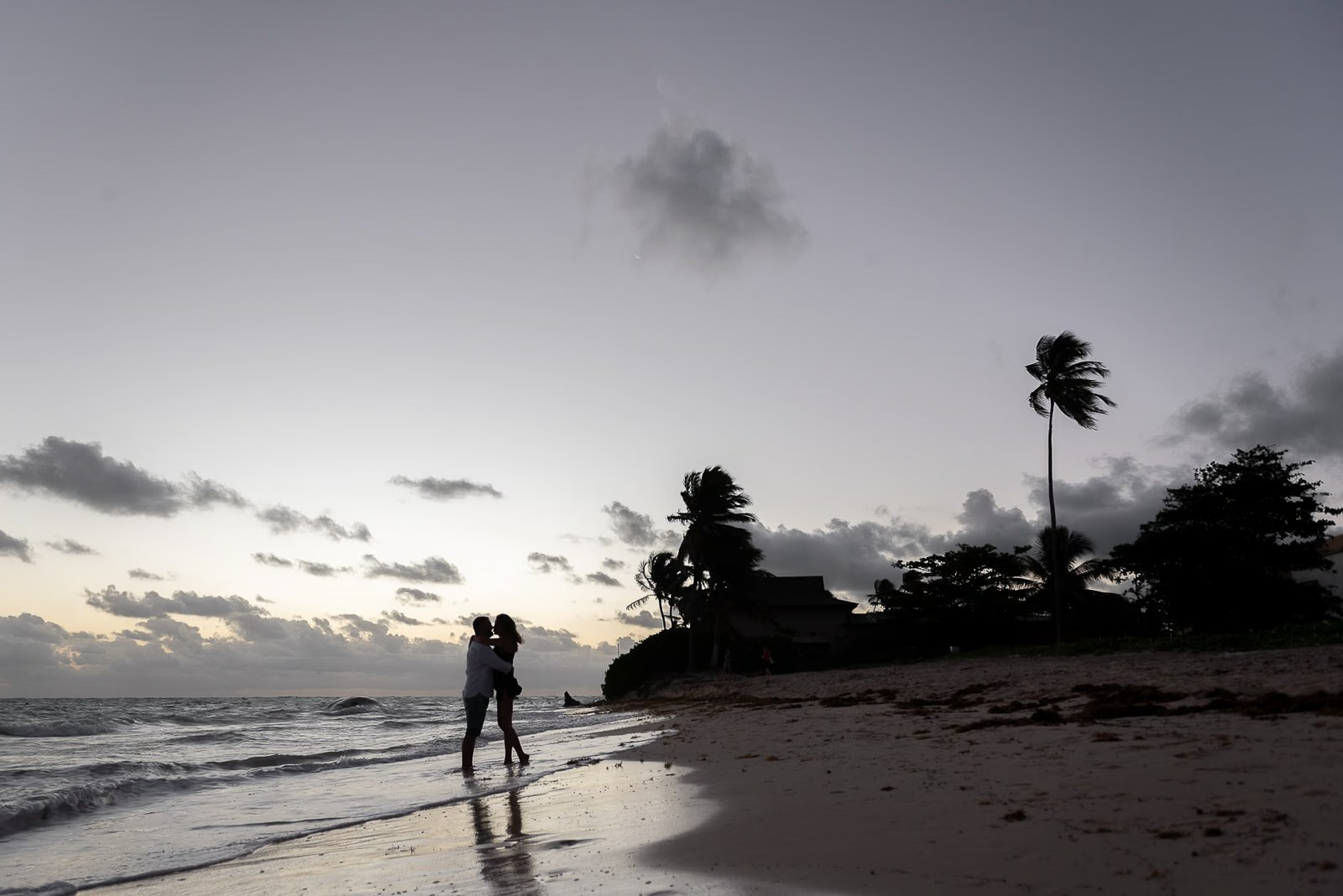 Couple hugging on Bavaro Beach during the blue hour before sunrise