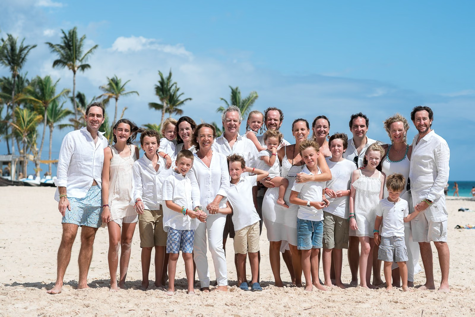 Natural family portraits on Bavaro Beach with turquoise Caribbean water in Punta Cana.