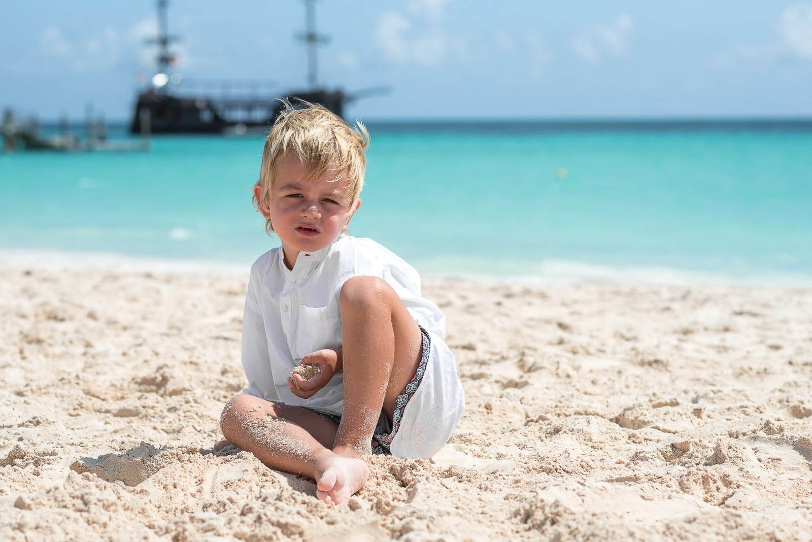 Family enjoying a tropical beach vacation photoshoot in Punta Cana.