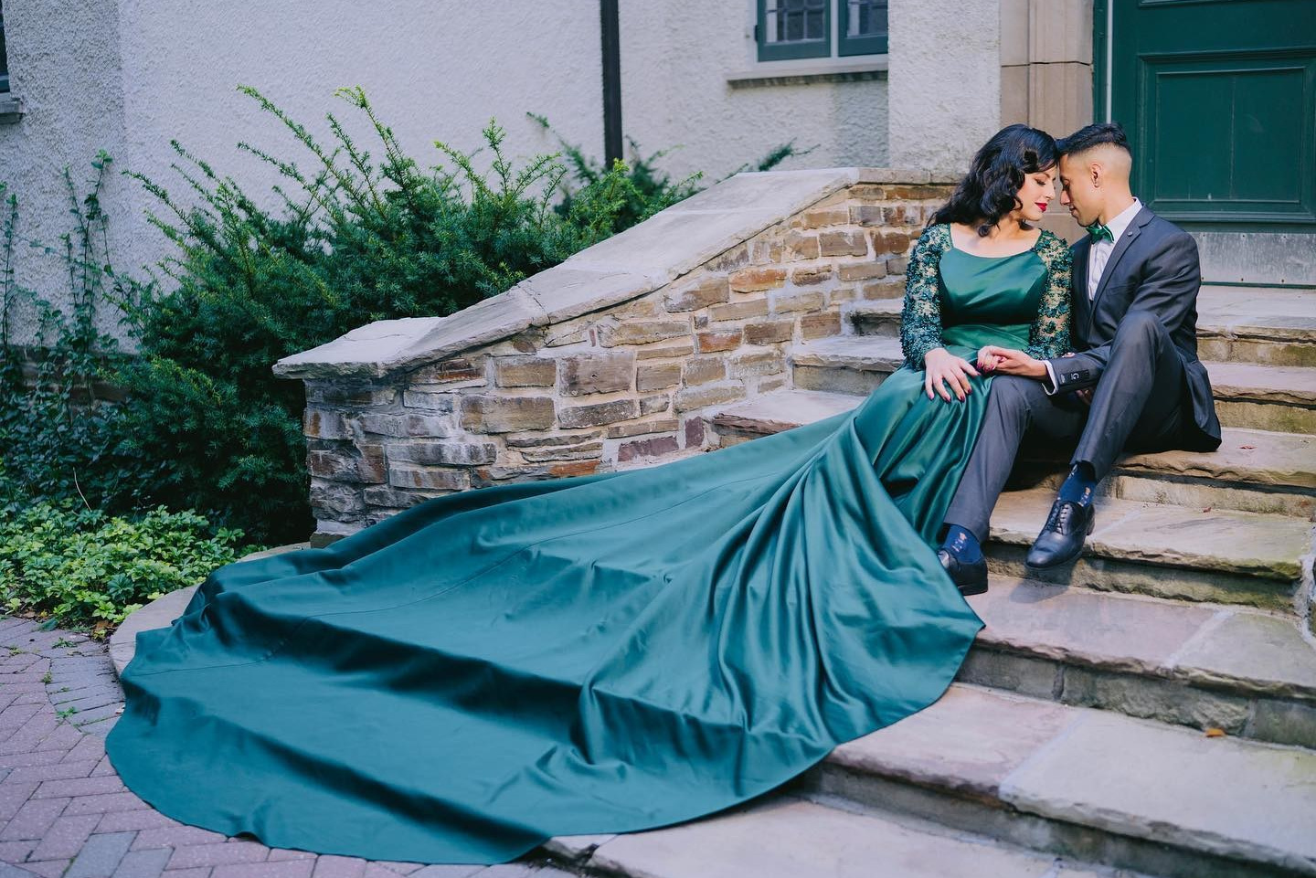 ride posing on vintage sofa in turquoise blue bridal lehenga