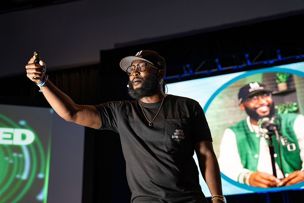Corporate presenter delivering valuable content to attentive crowd.