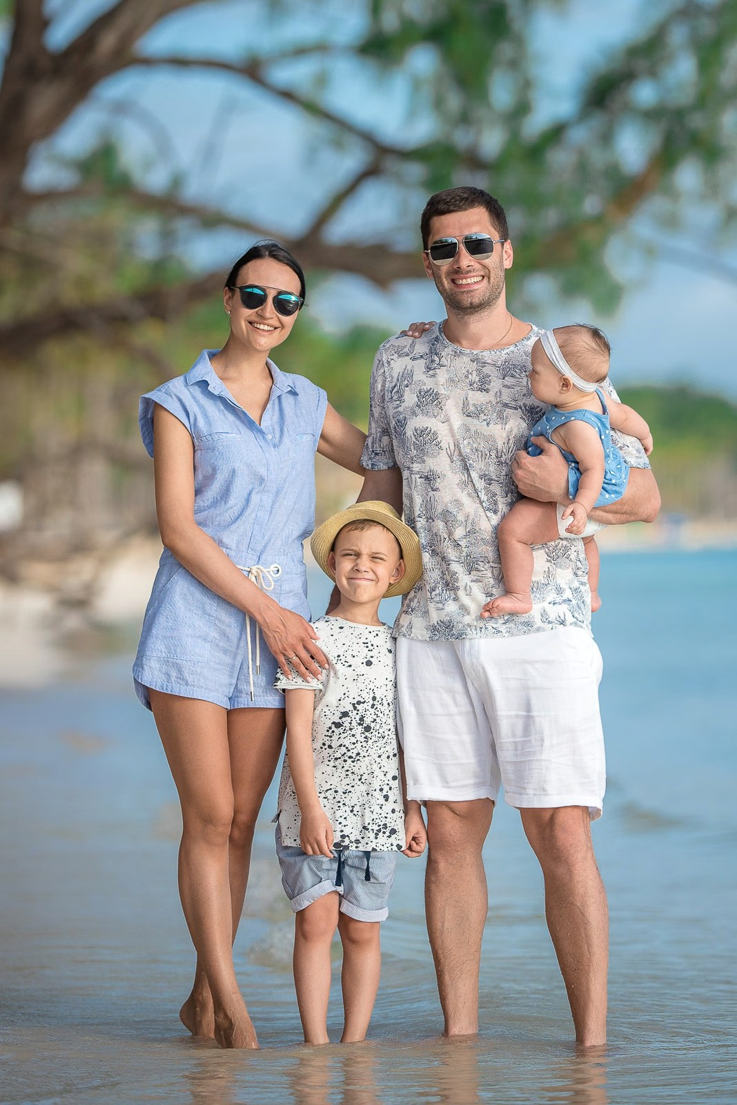 Portrait of a family of four during a photoshoot in Punta Cana