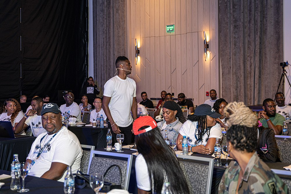 Keynote speaker sharing insights as crowd pays close attention.