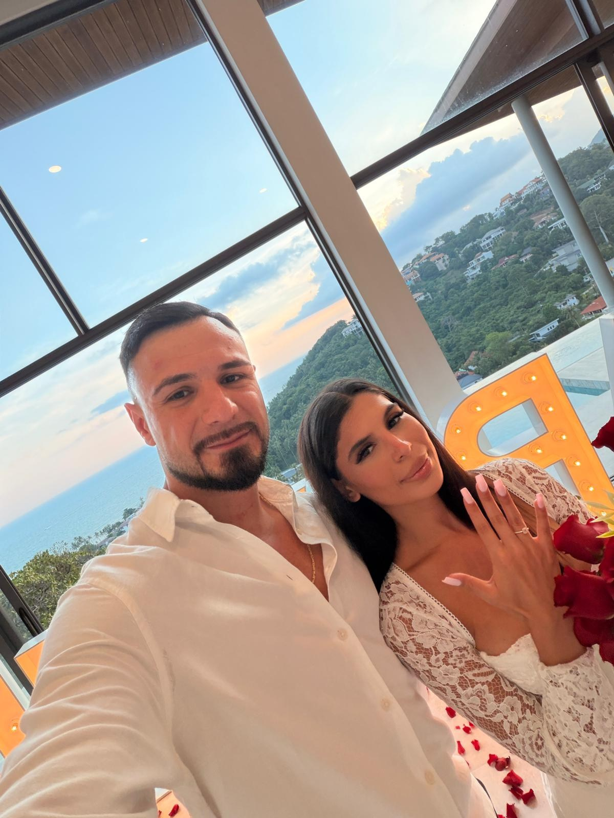Luxury villa proposal setup in Koh Samui with ocean view and romantic candlelight.