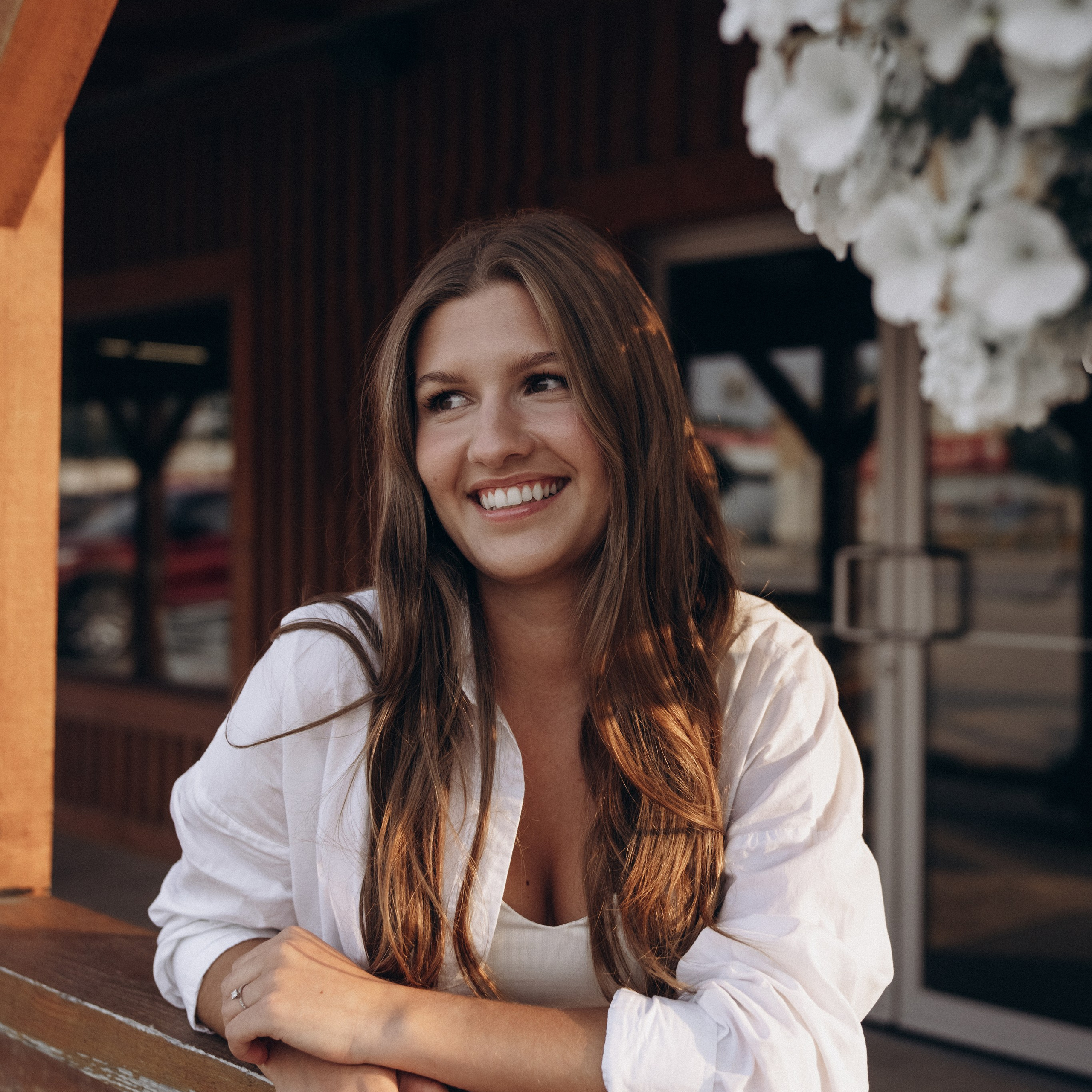 Smiling woman in an urban setting.