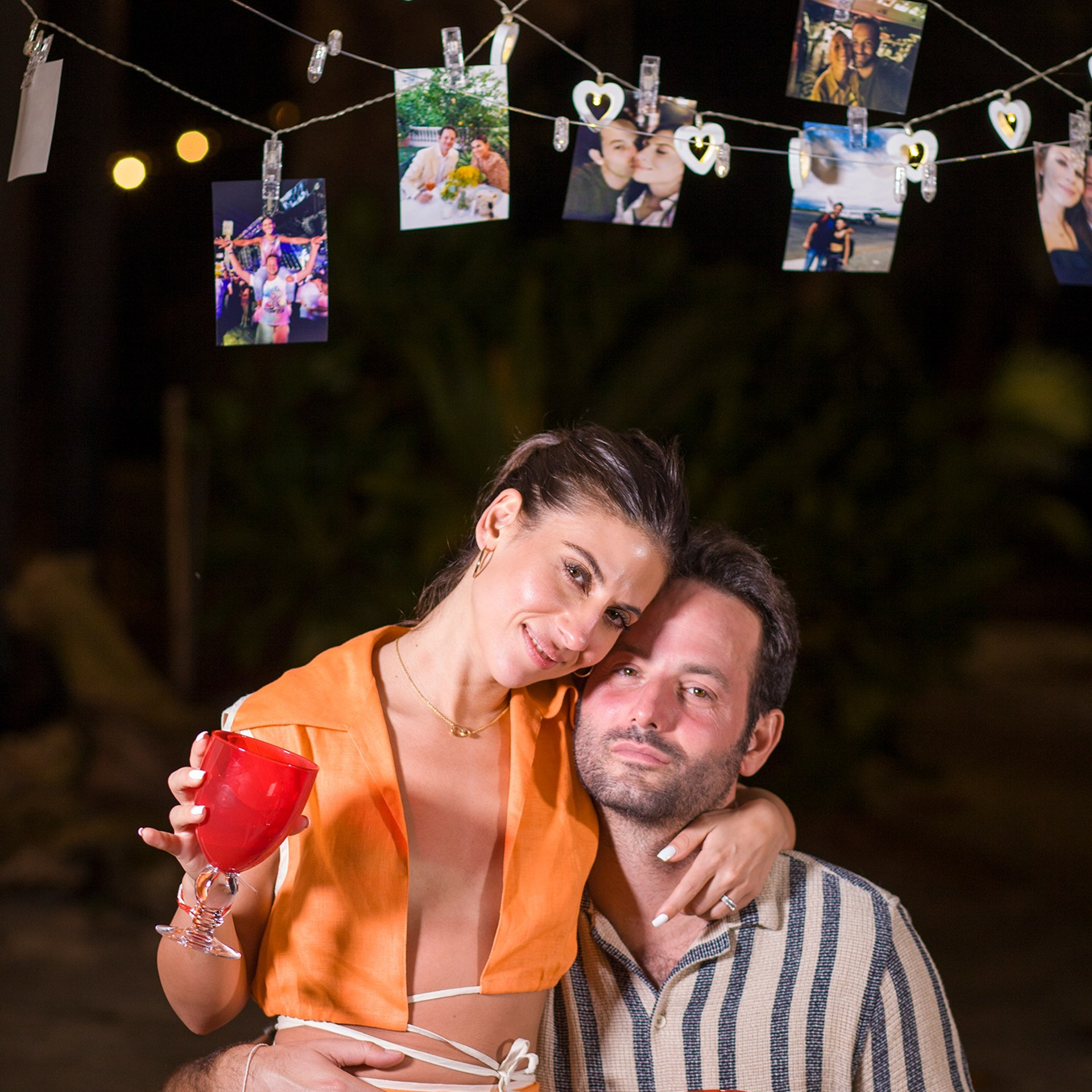 Romantic beach proposal setup in Koh Samui with candles and flower arch.