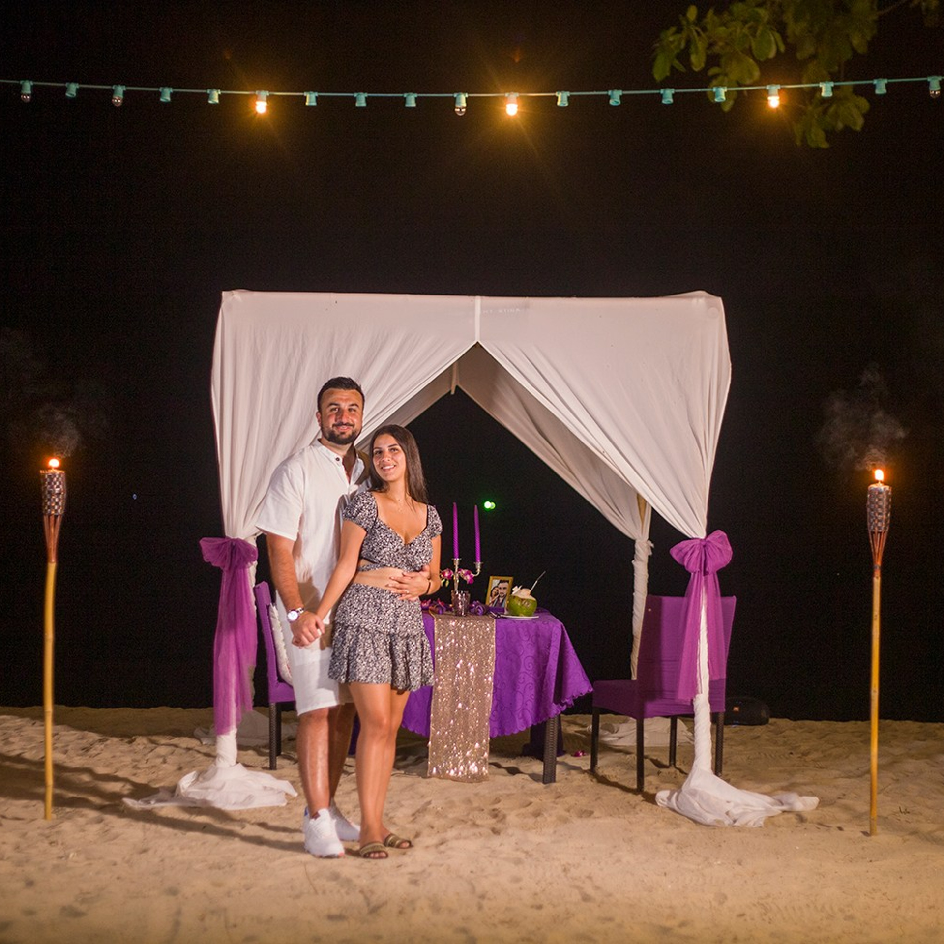 Luxury beach proposal in Koh Samui, Thailand. Private sunset setup with candles, flowers, and ocean view for an unforgettable engagement experience.