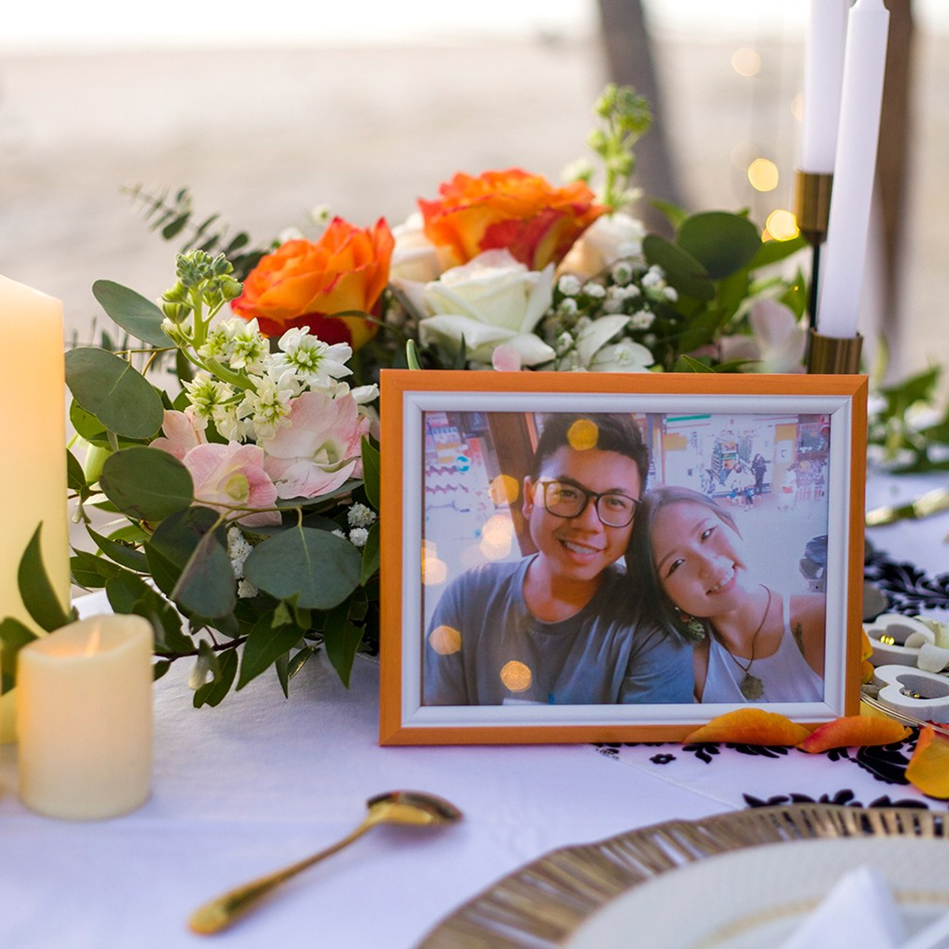 Romantic beach proposal setup in Koh Samui with candles and flower arch.Romantic beach proposal setup in Koh Samui with candles and flower arch.